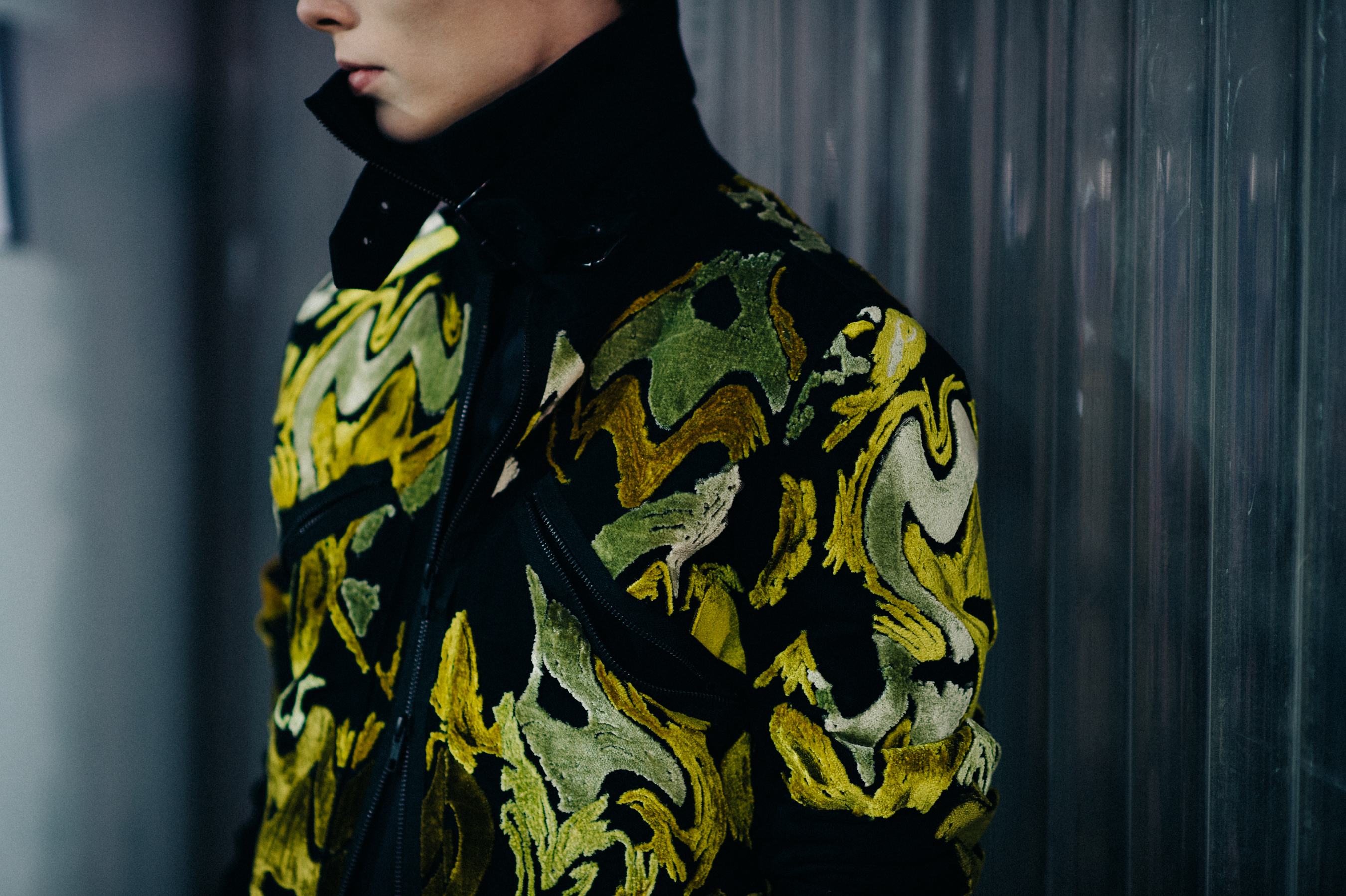 Male model wearing embroidered jacket