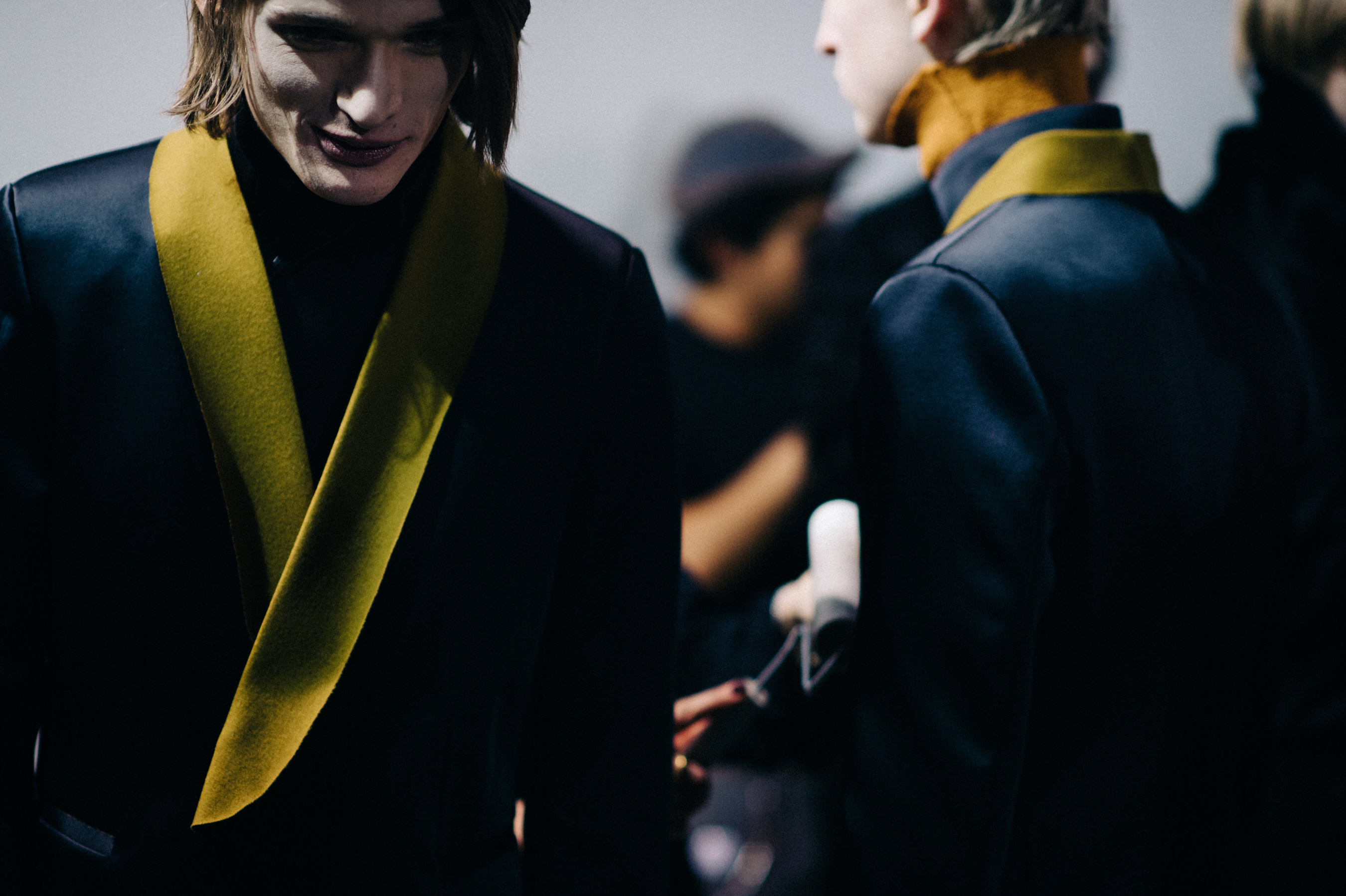 Male model wearing yellow tuxedo
