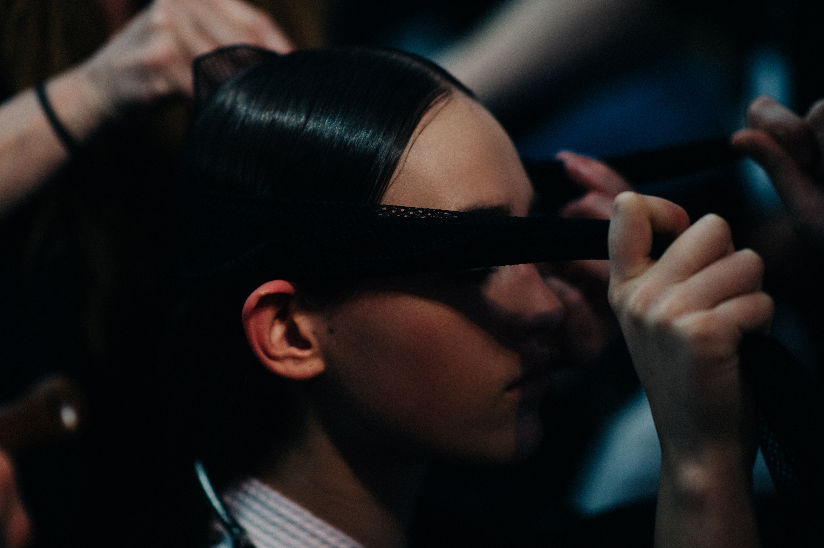 Model getting hair made sleek
