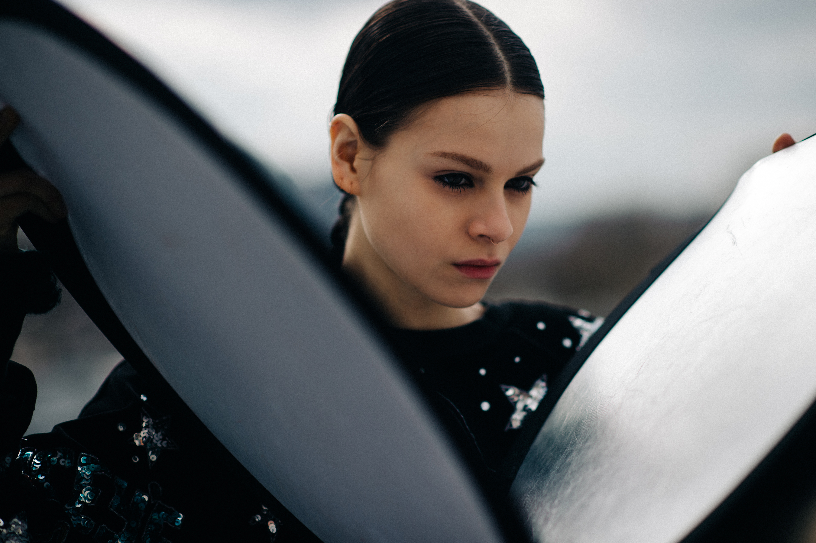 Model holding two reflectors