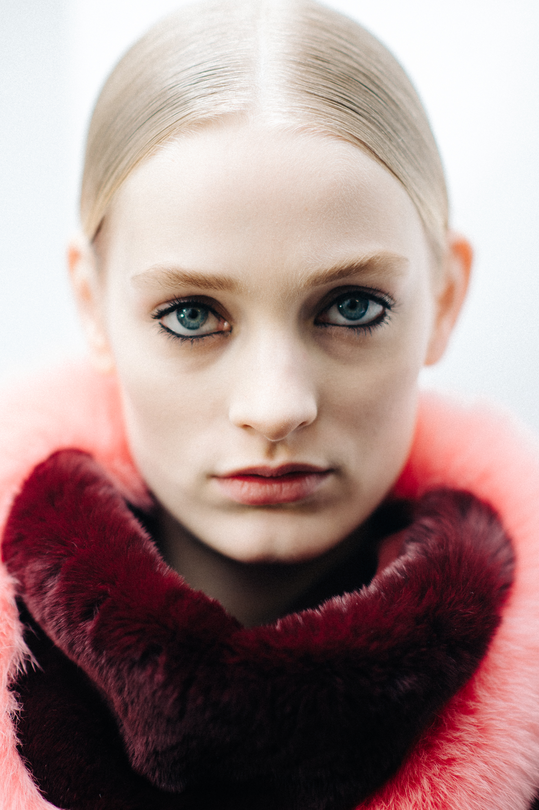 Portrait of a blonde model pink fur