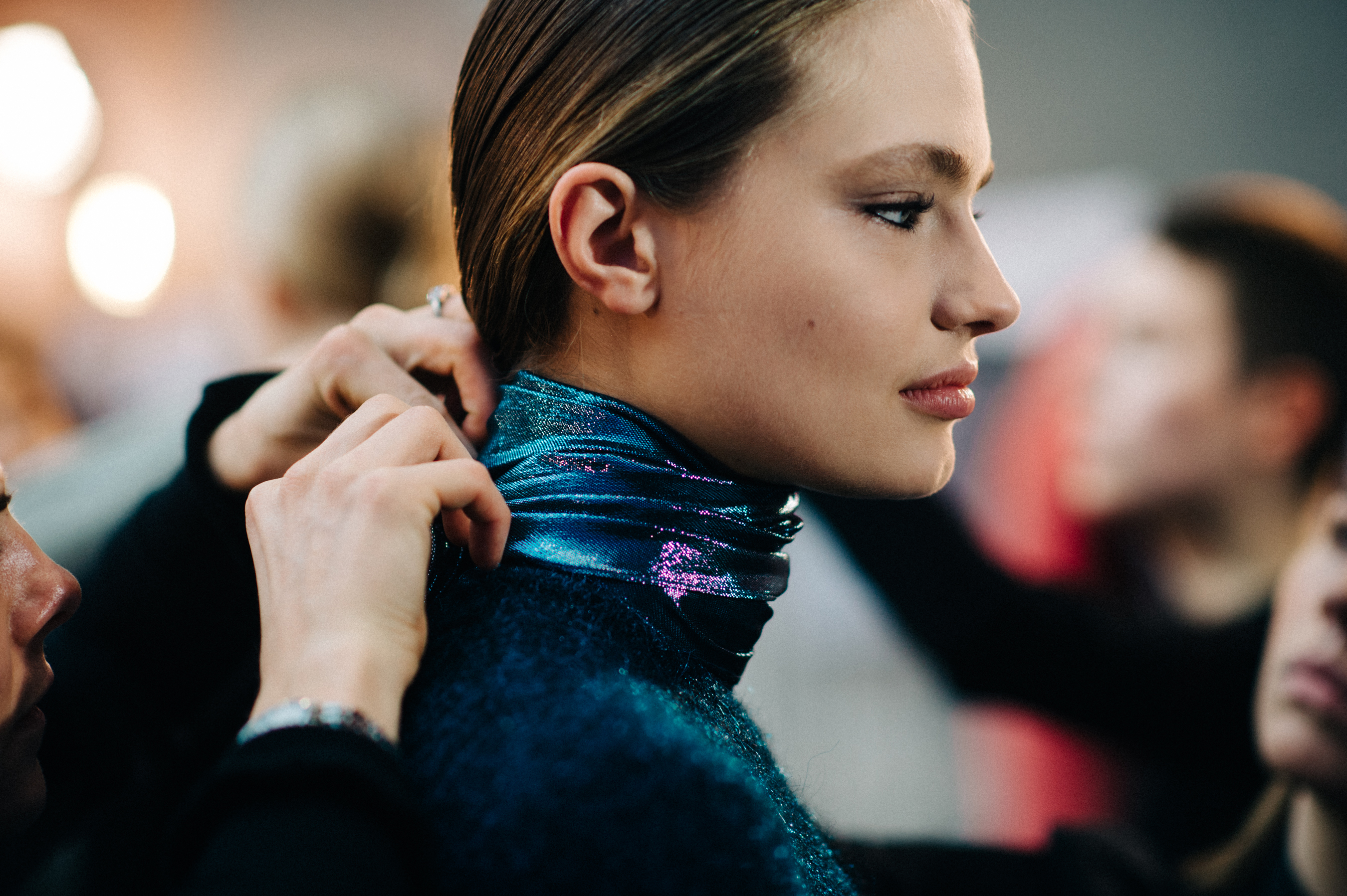 German model getting dressed in blue