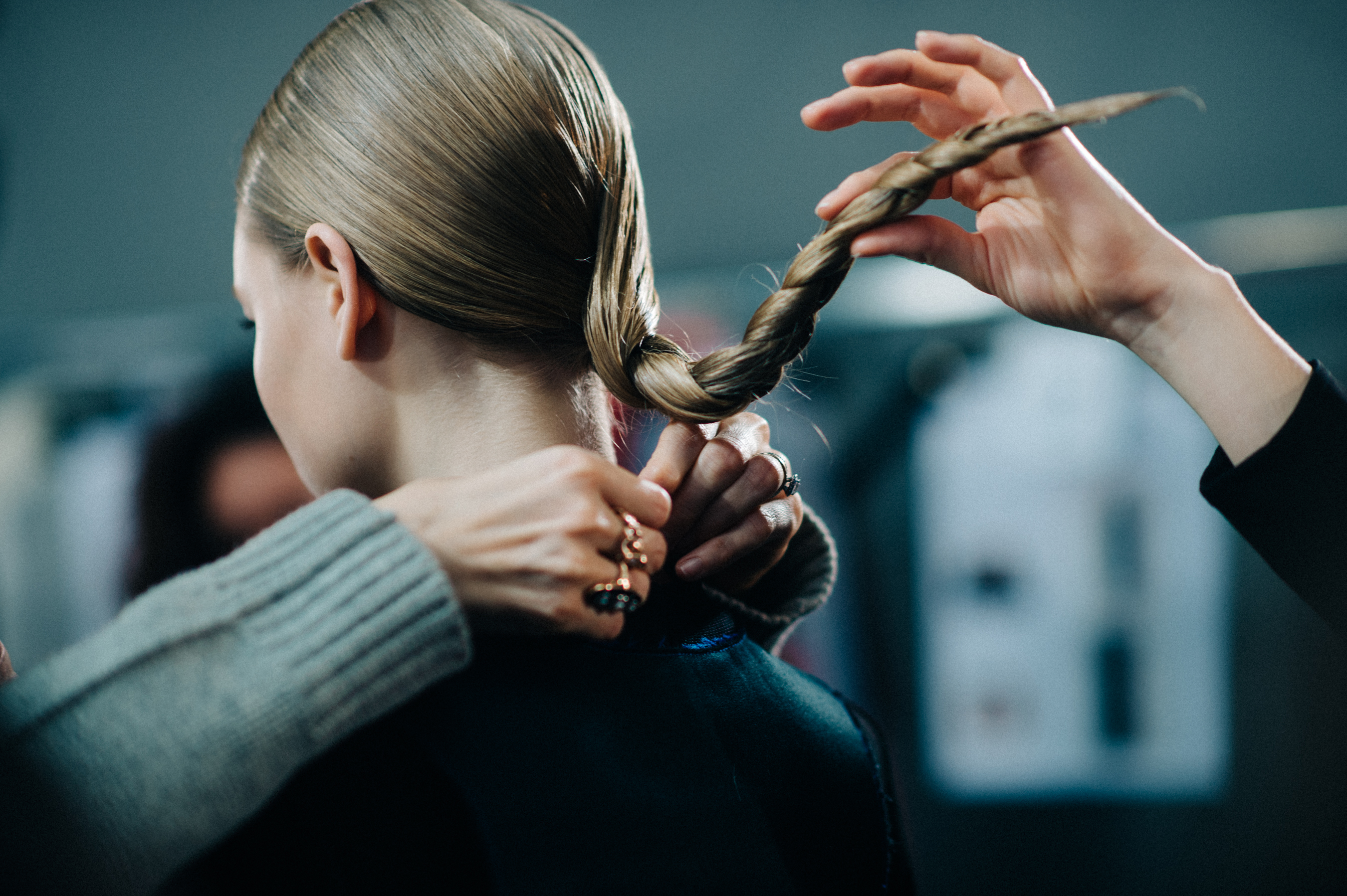 Blonde model getting hair braided
