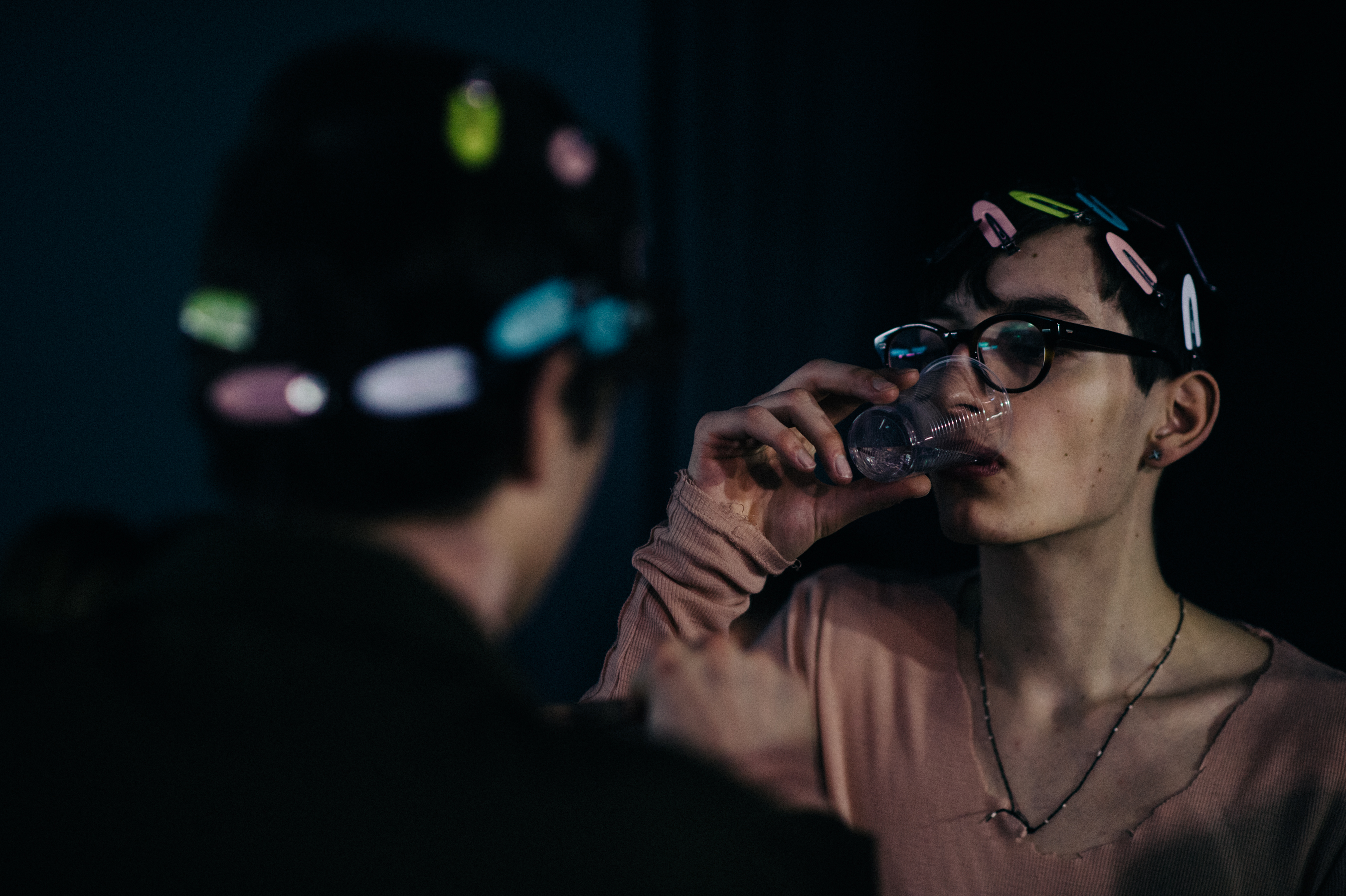 Male model drinking water clipped hair