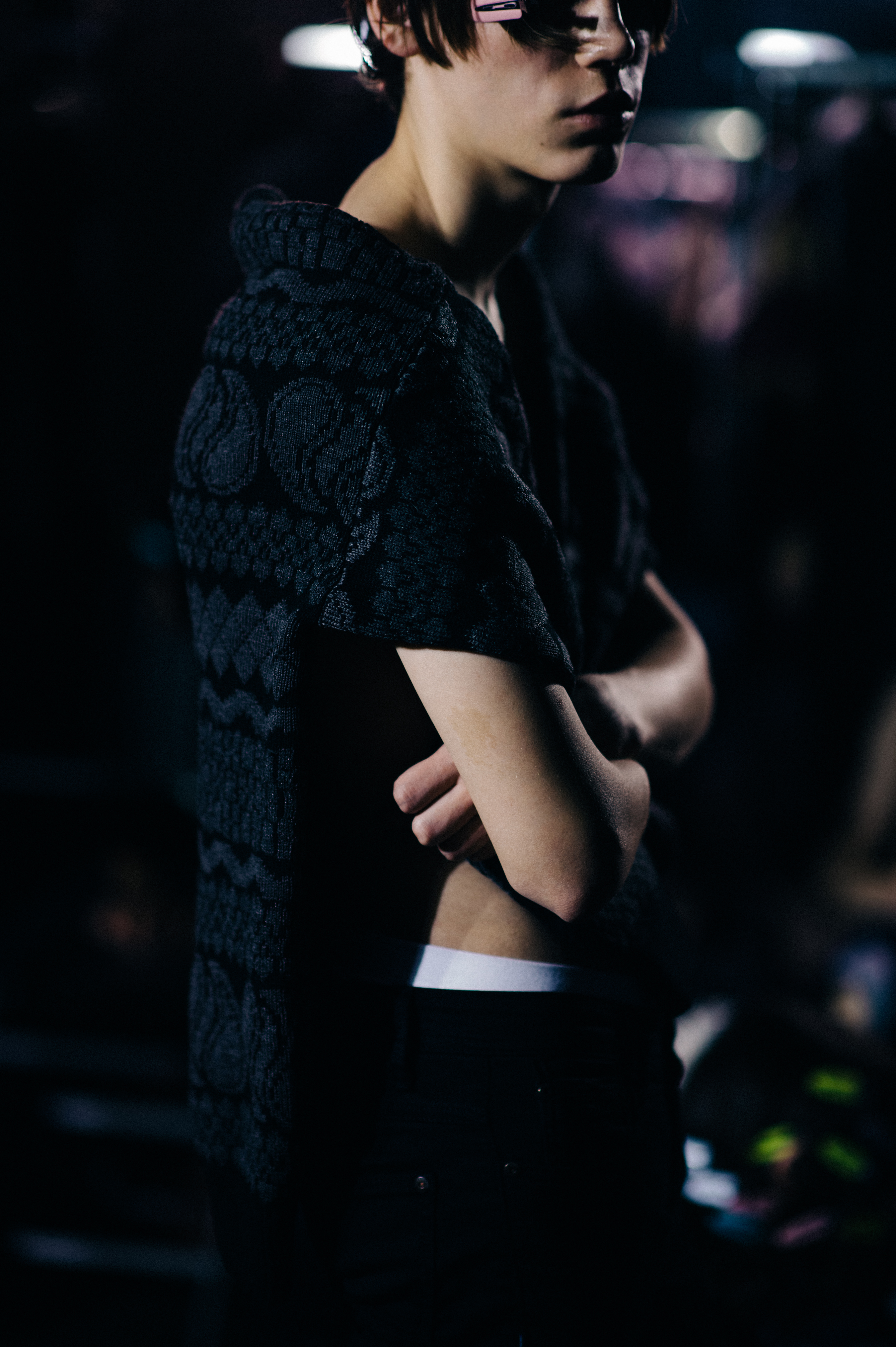 Male model wearing sweater before show