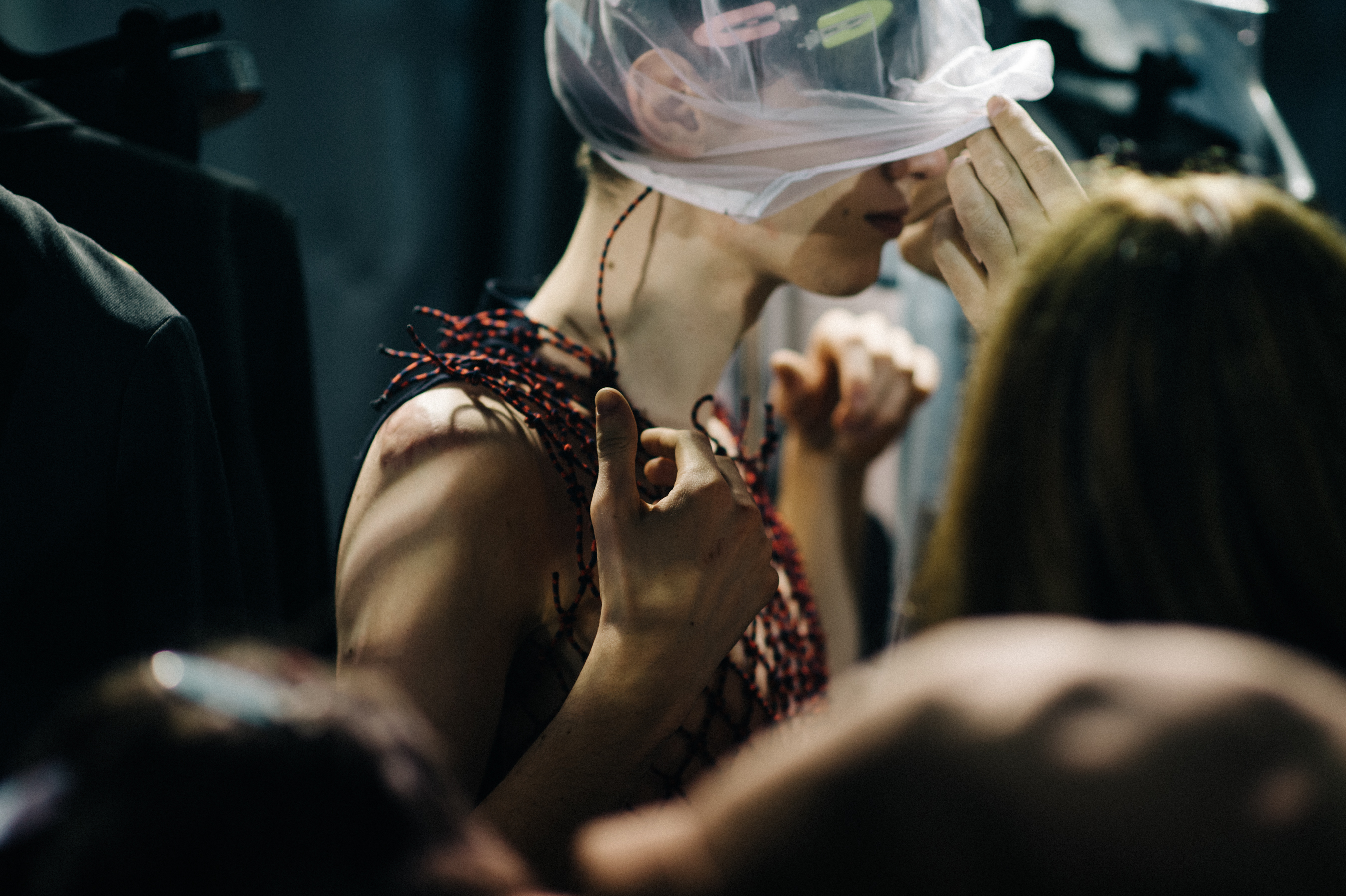 Male model getting dressed before show