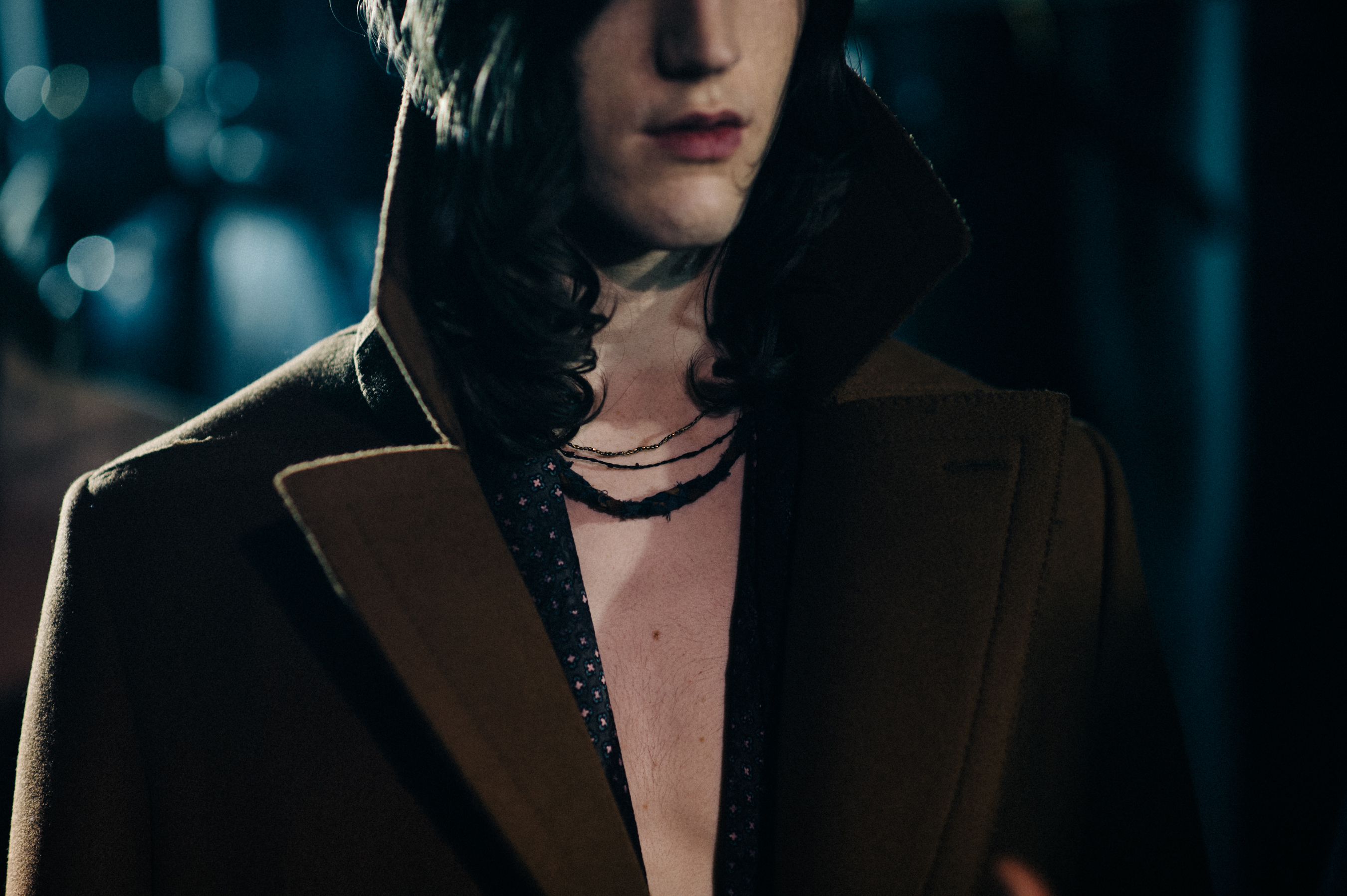 Male model wearing brown coat