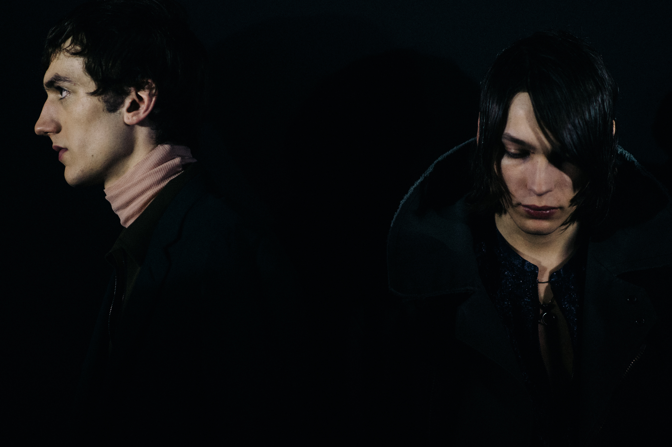 Two male models lined up before show