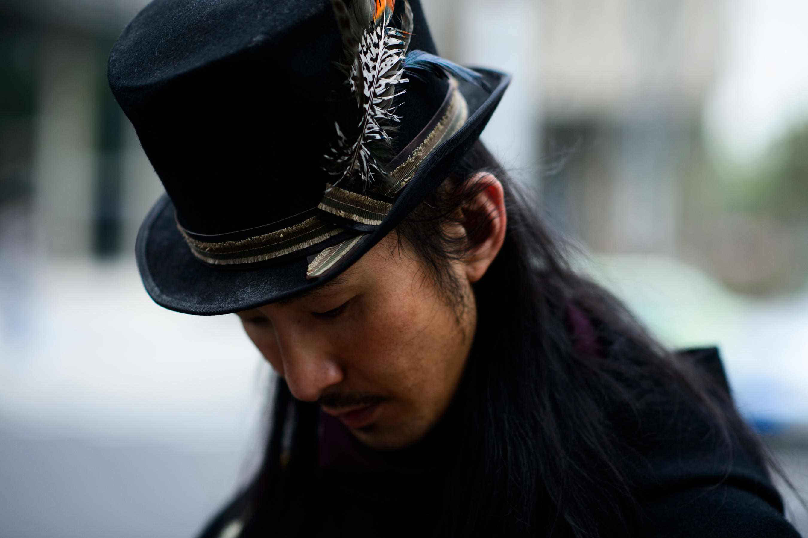 Chinese man vintage top hat feathers
