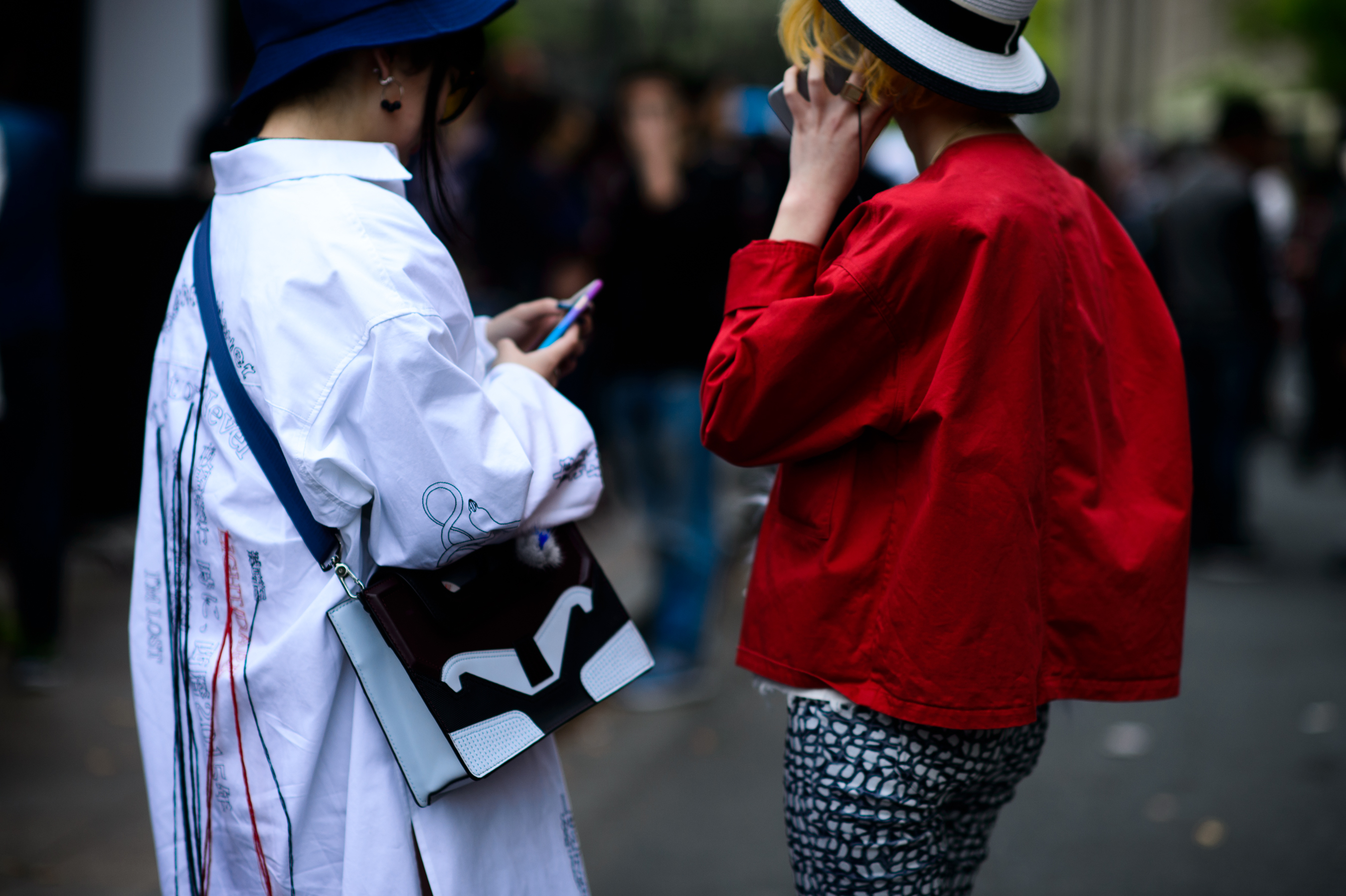 Two women wearing red and white