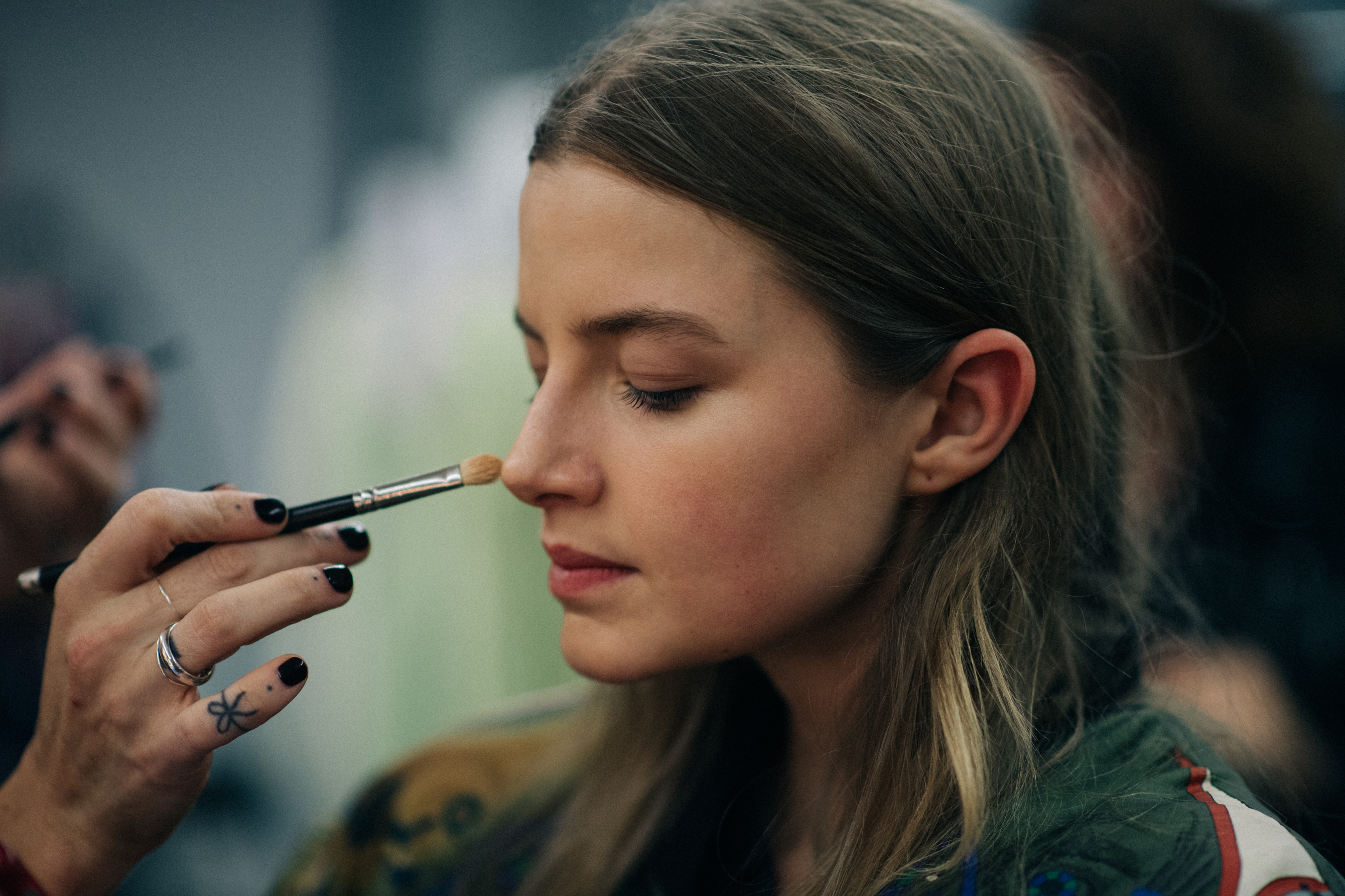Model getting her make up done