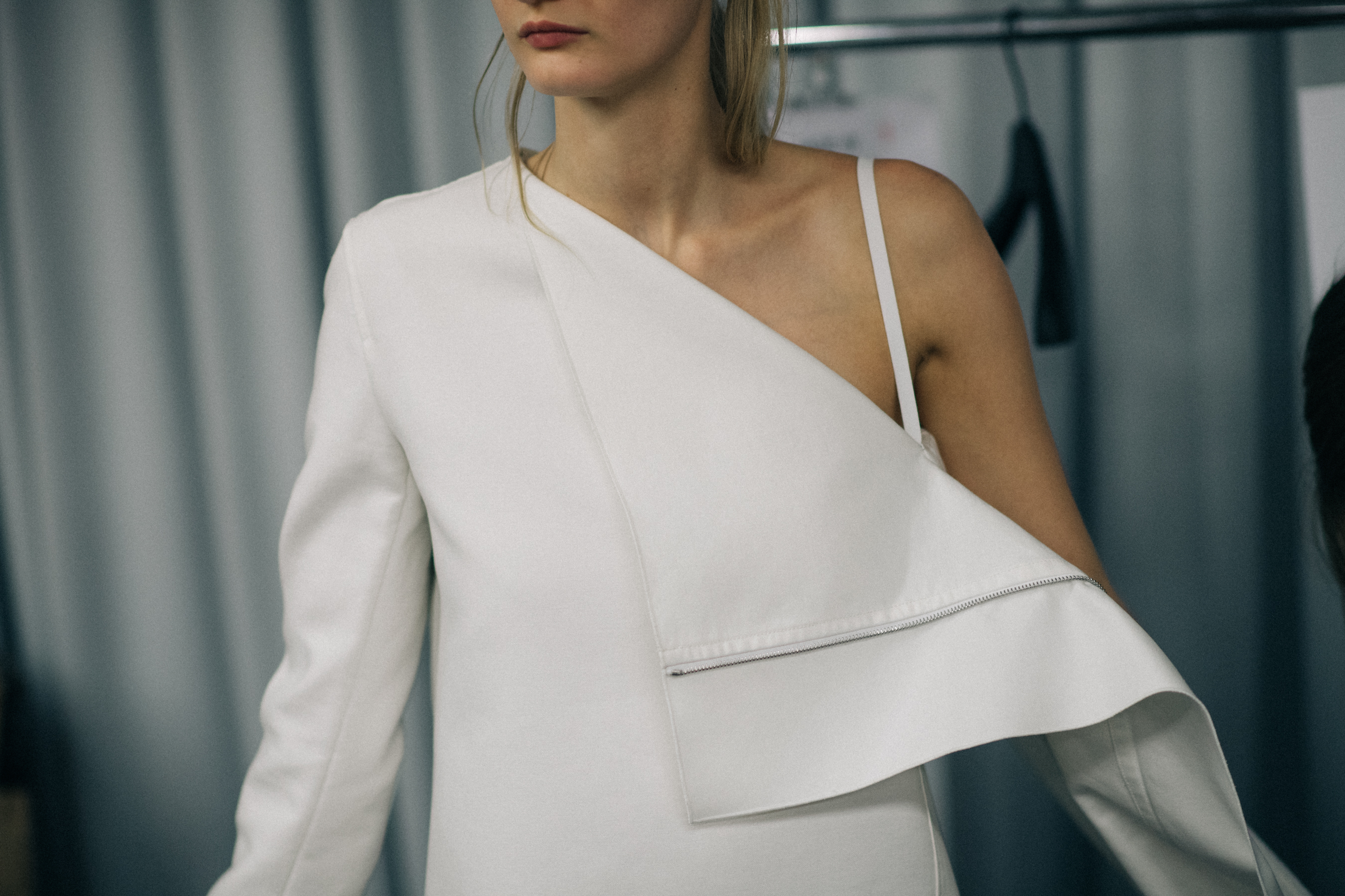 Model wearing all white outfit