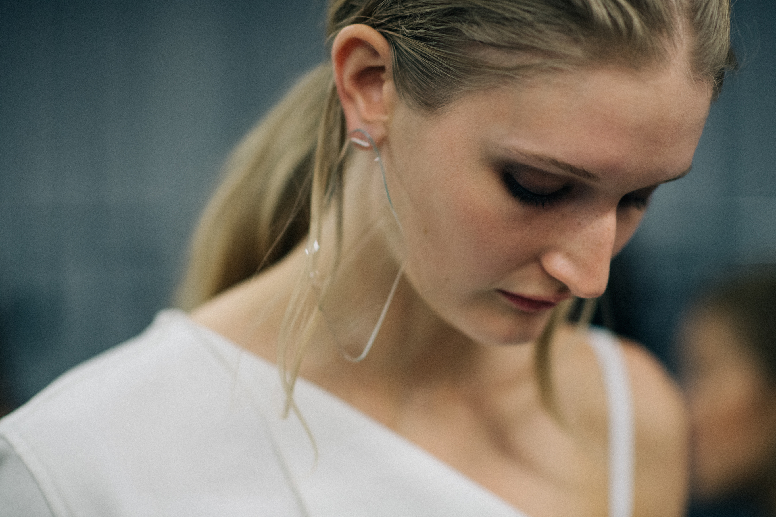 Model wearing transparent glass earring