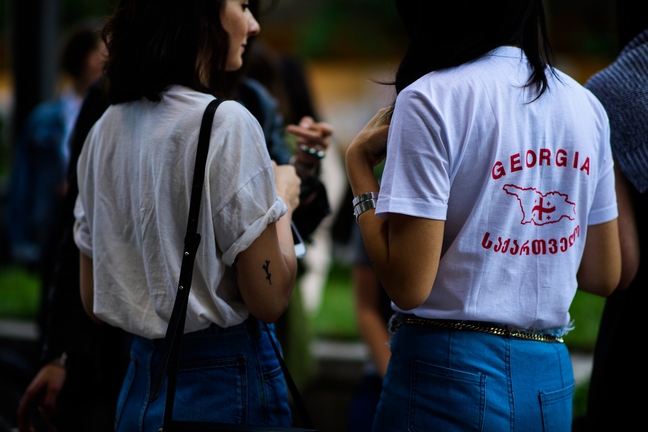Two girls wearing white t-shirts