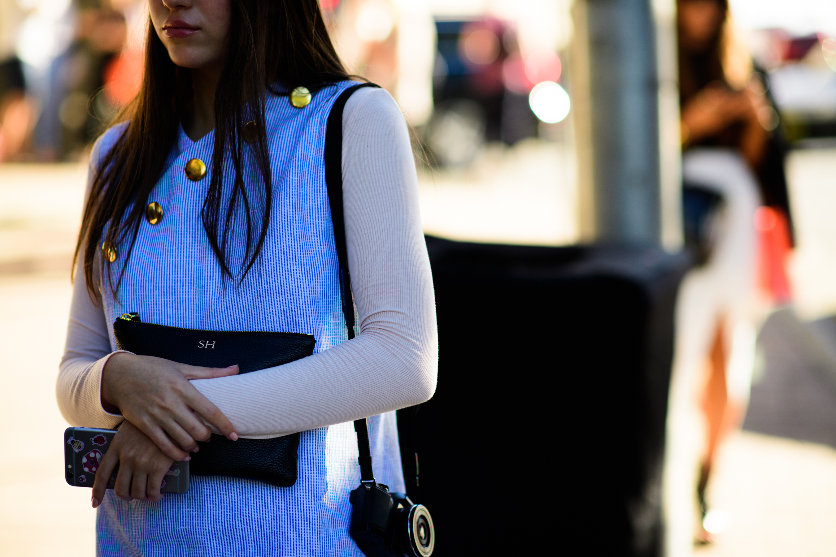 Woman wearing blue white sleeve top