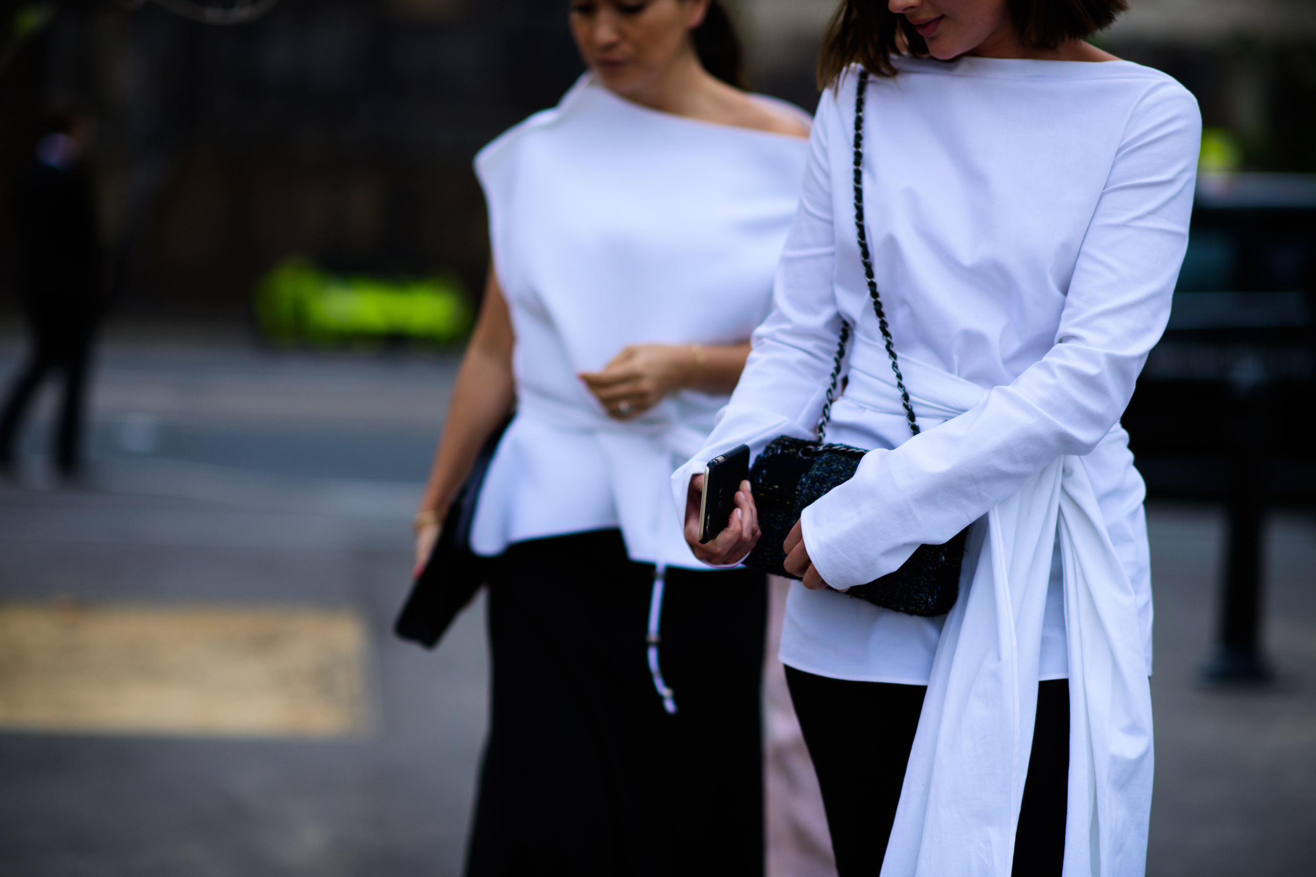 Two women in white wrap shirts