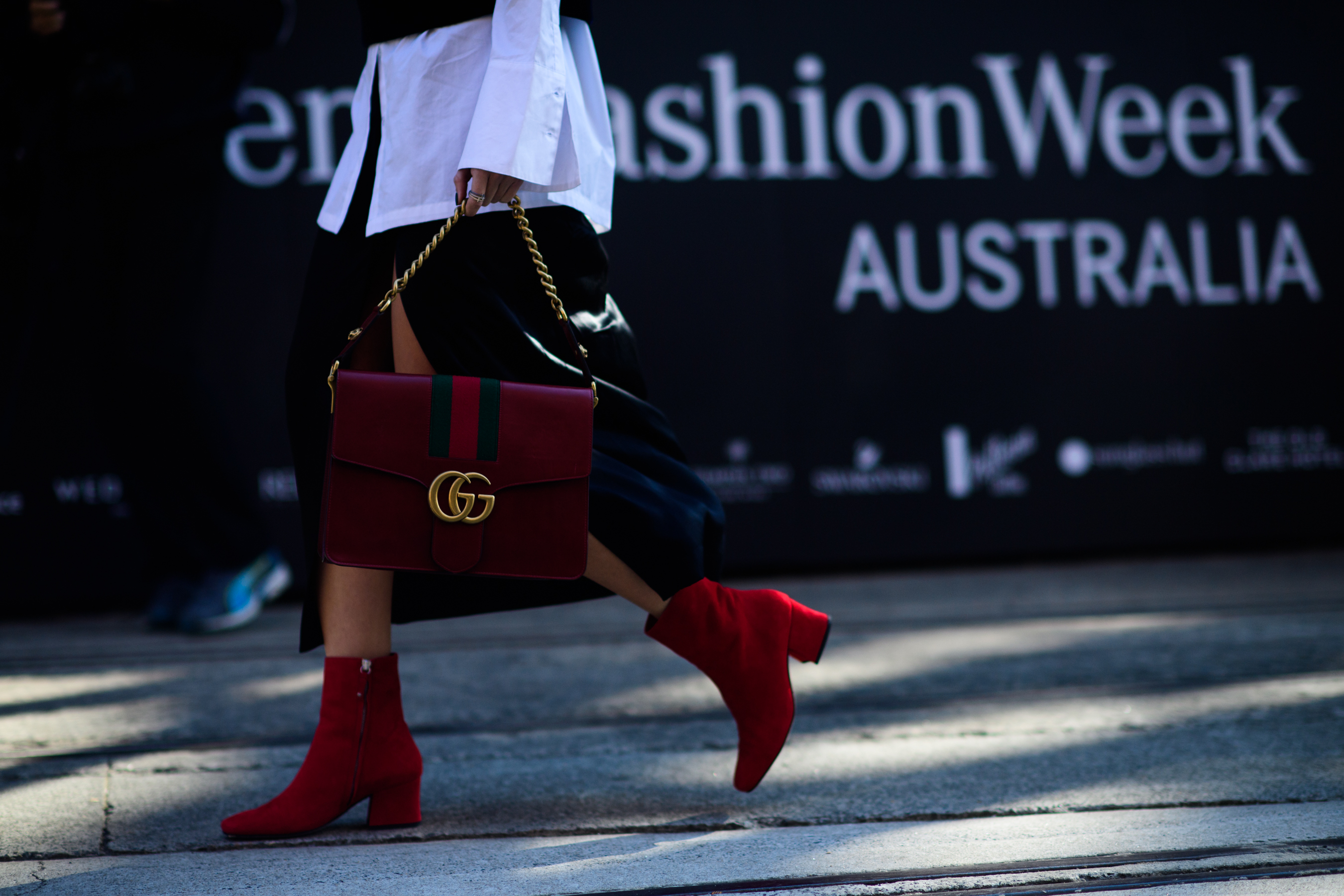 Blogger wearing red boots gucci bag