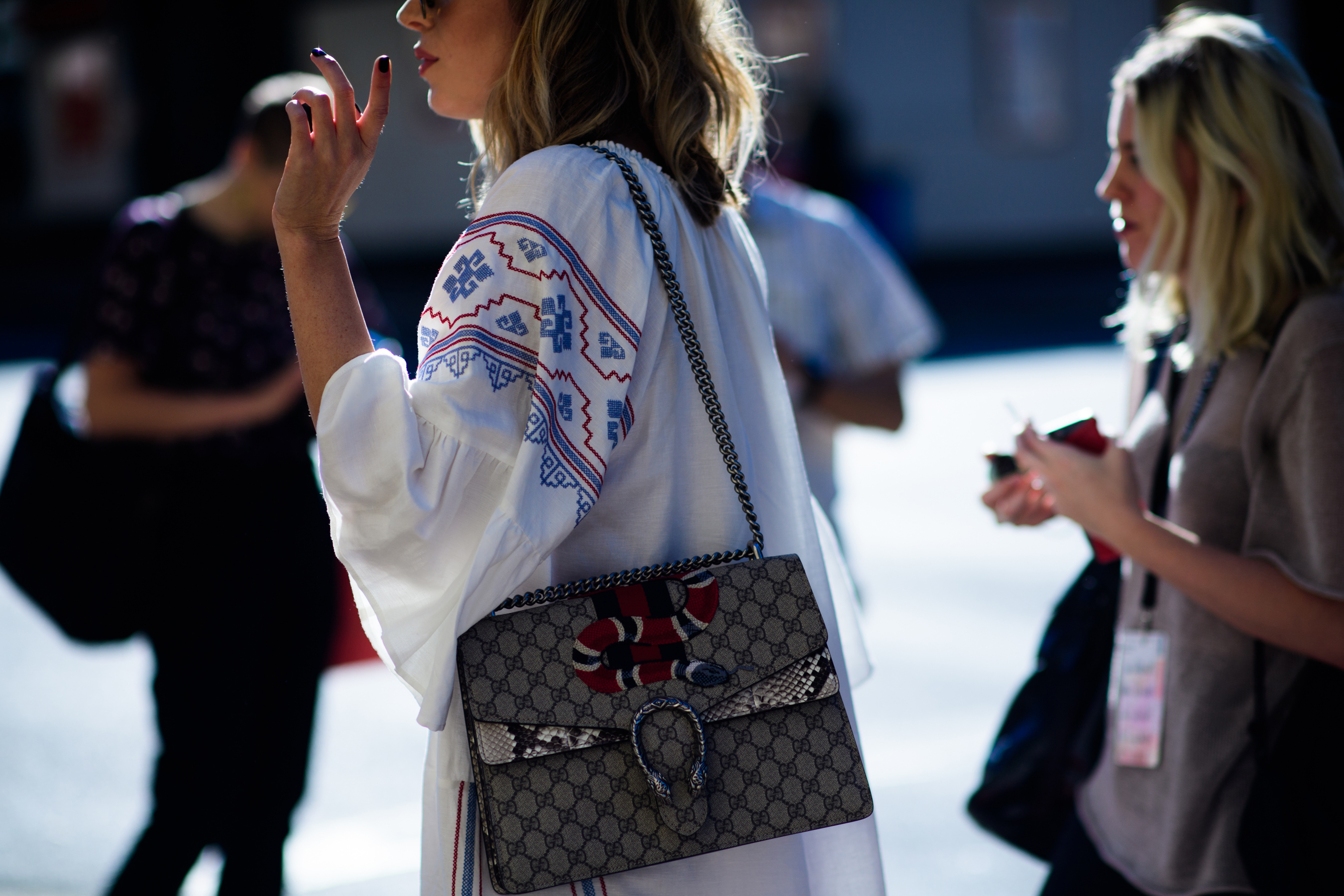 Woman wearing Gucci snake bag