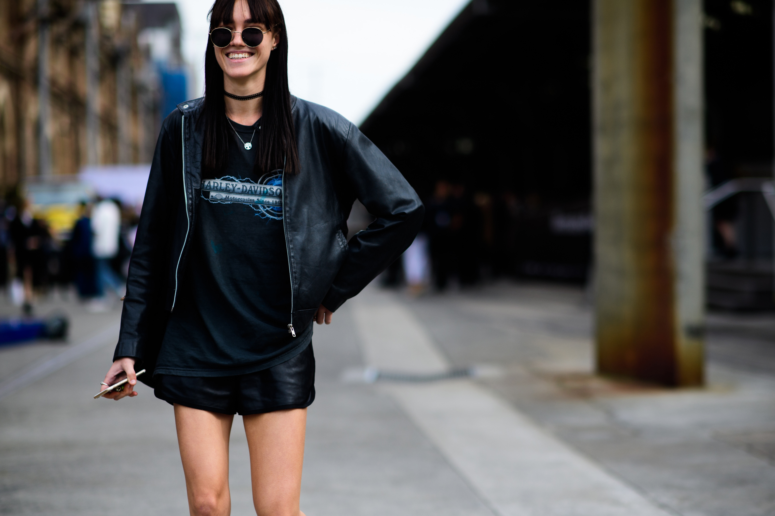 Model wearing biker t-shirt and glasses