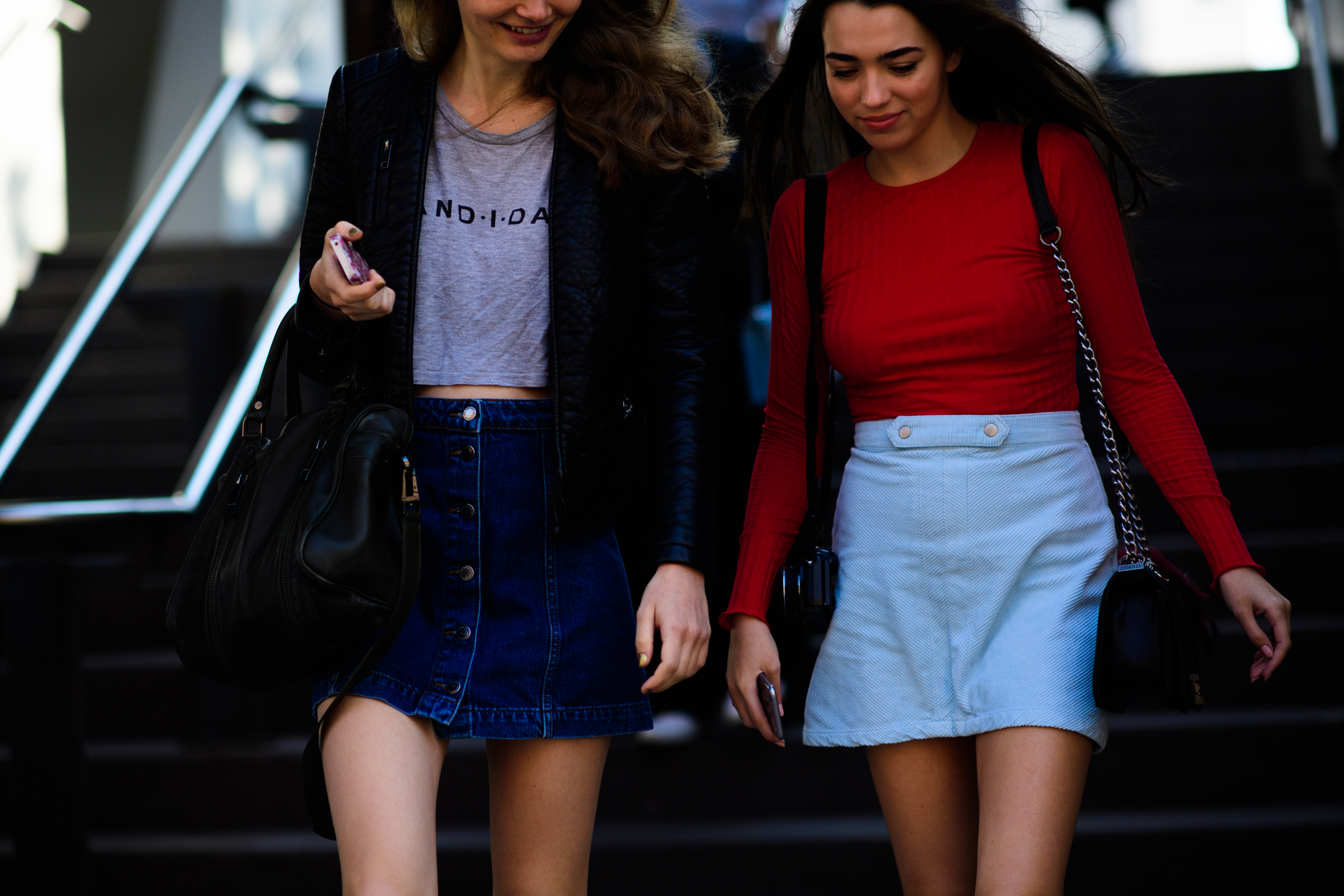 Two models wearing mini skirts