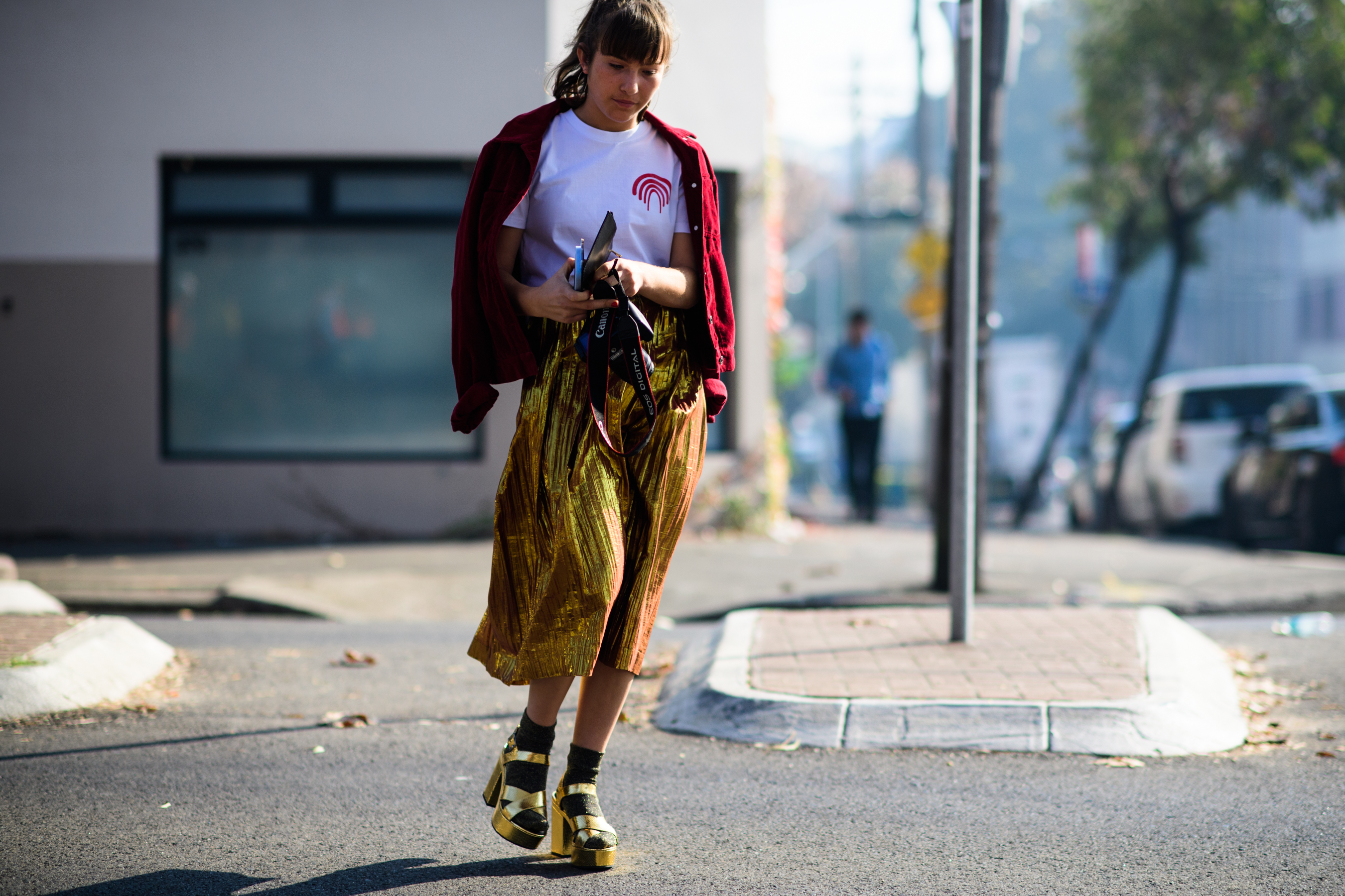 Woman wearing golden midi skirt