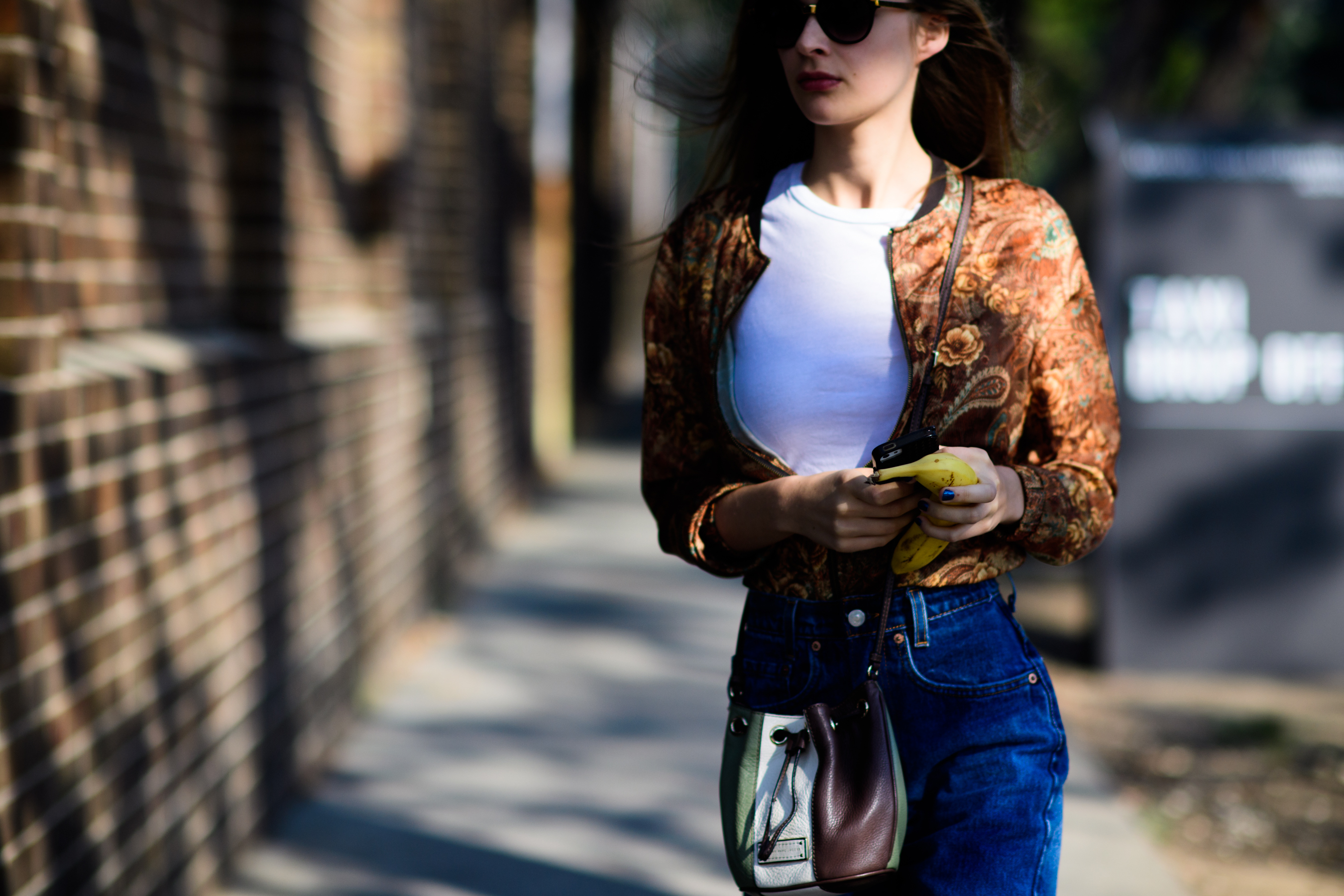 Girl wearing floral bomber jacket