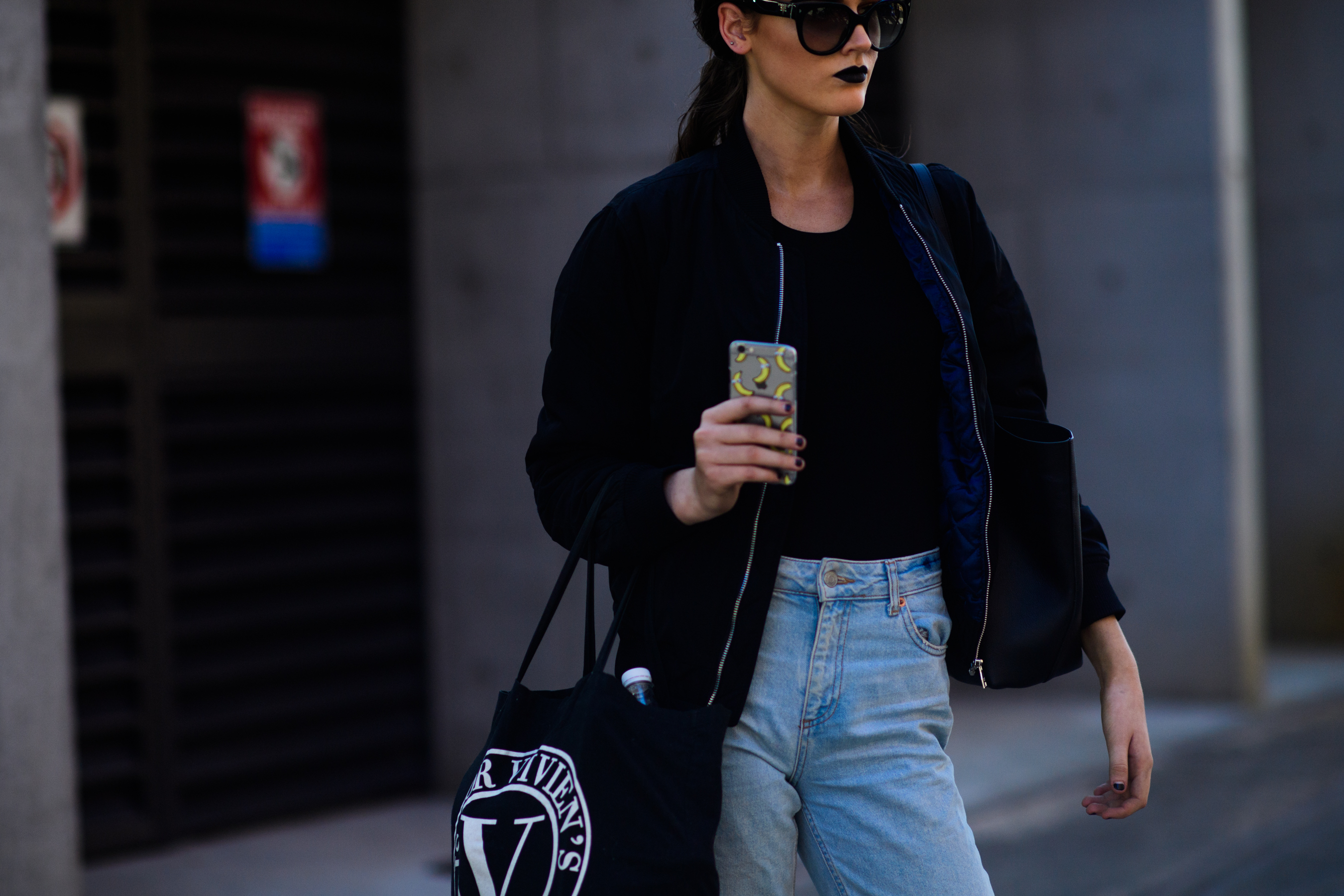 Model wearing black bomber jacket