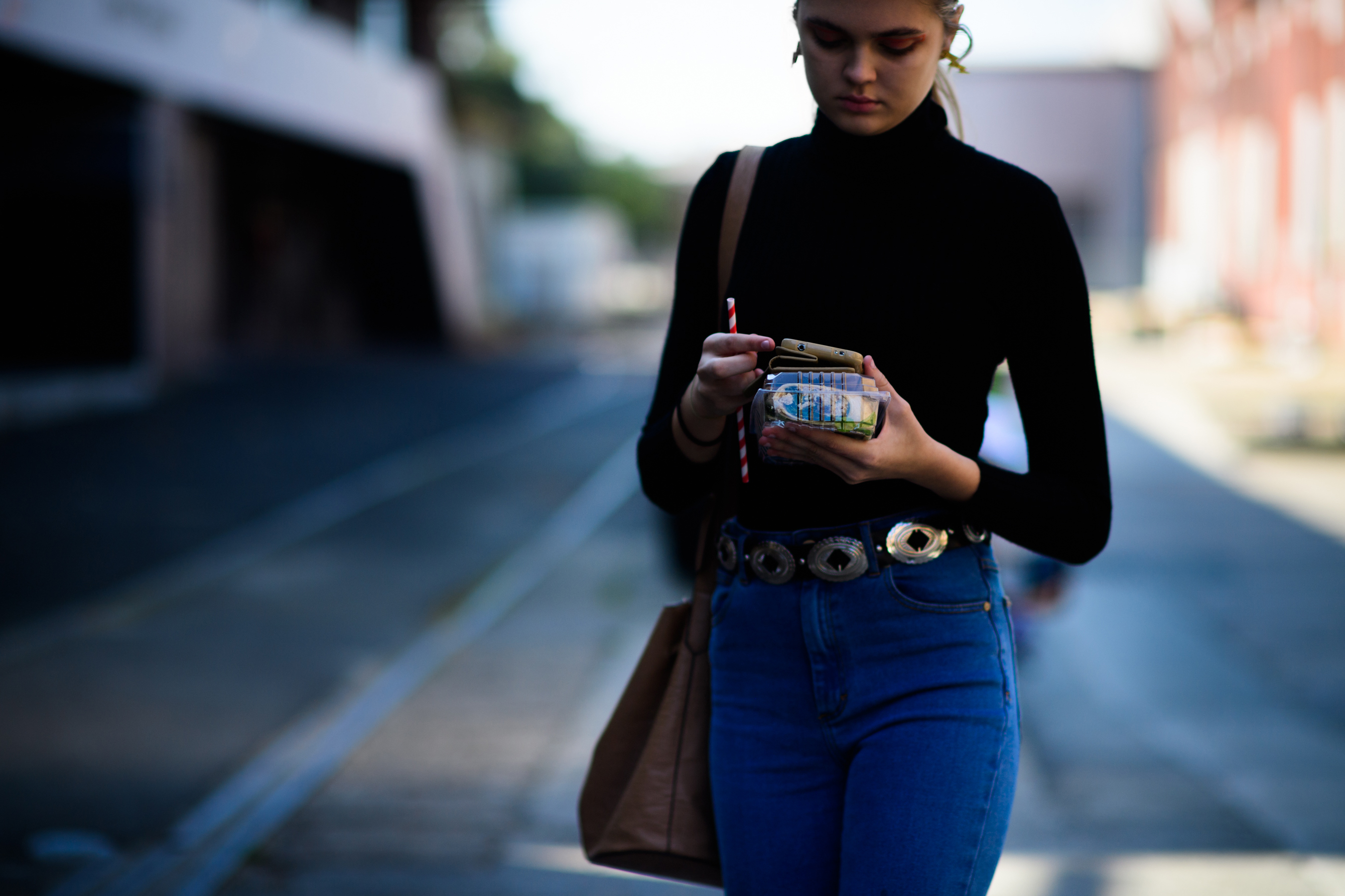 Model wearing denim with belt