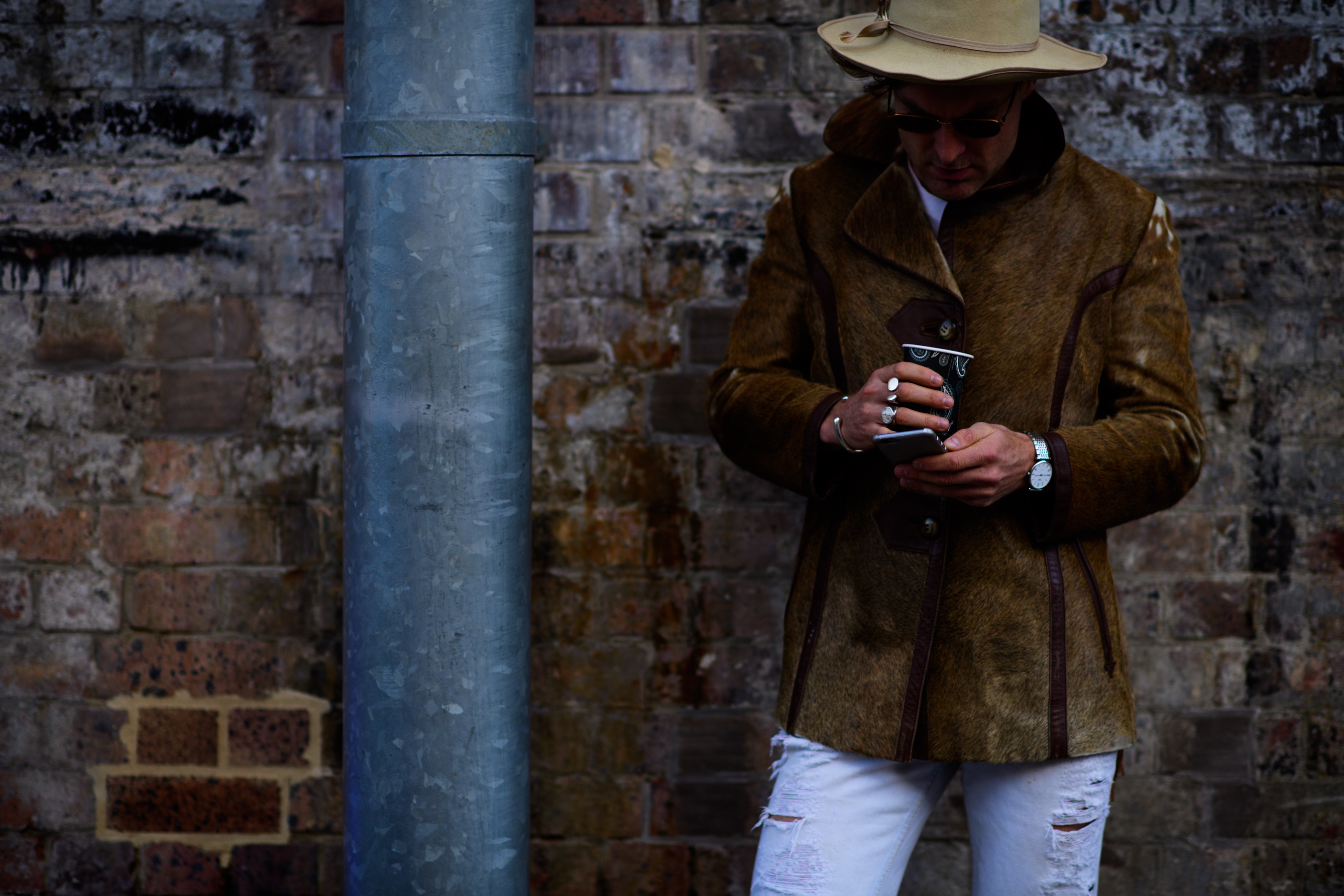 Man wearing cow fur jacket