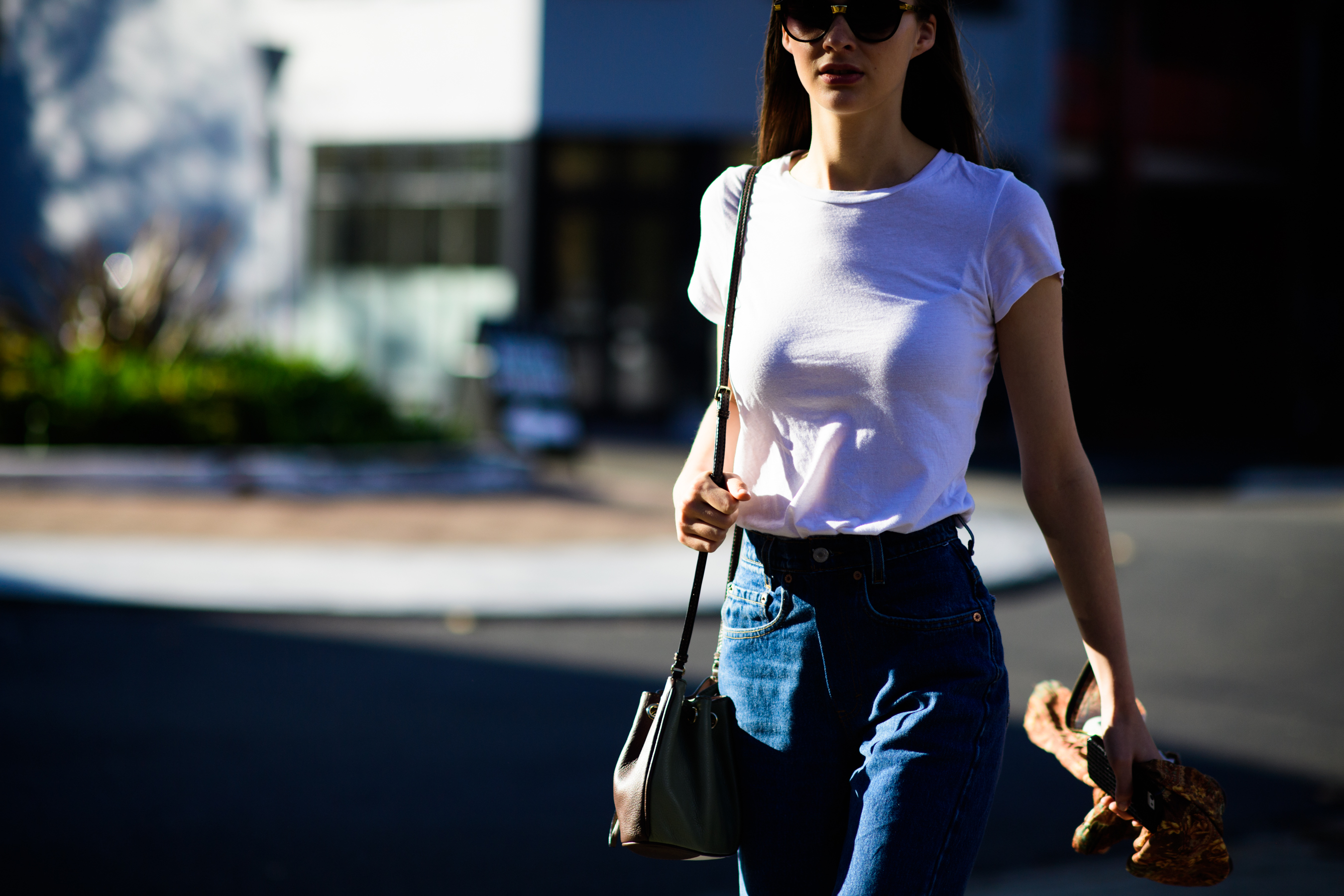 Woman wearing jeans and white t-shirt