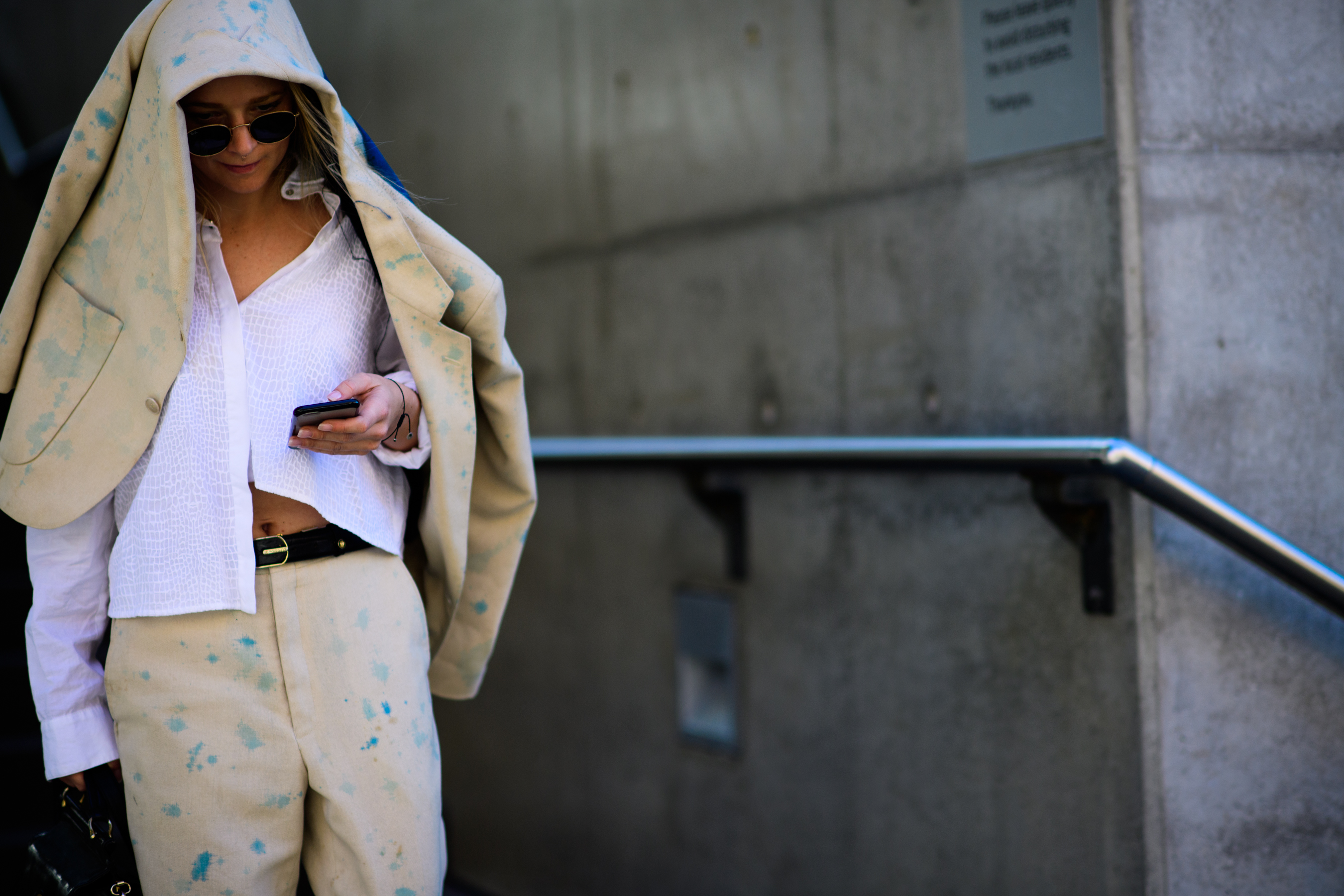 Woman wearing beige suit splashes