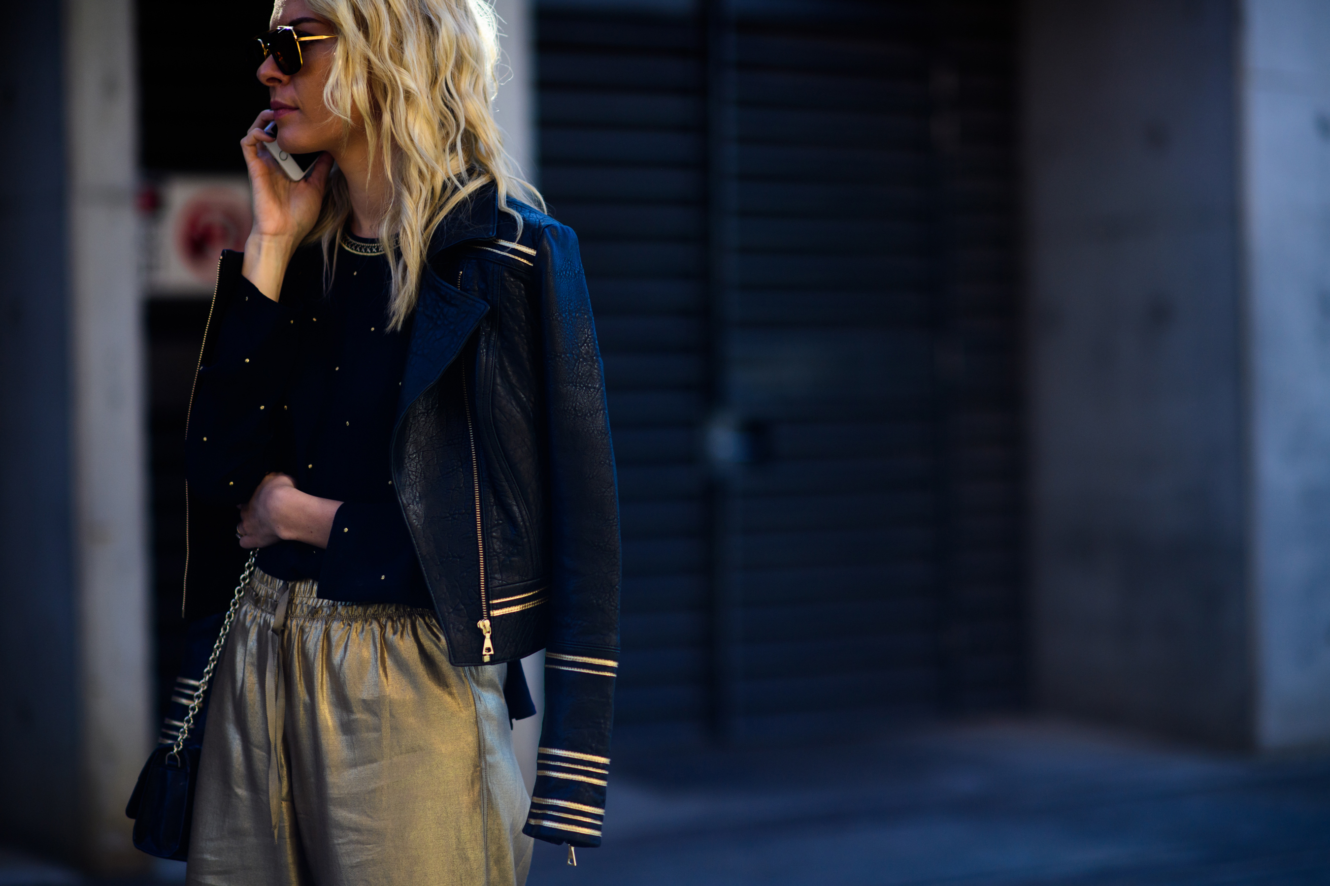 Blonde woman wearing leather jacket