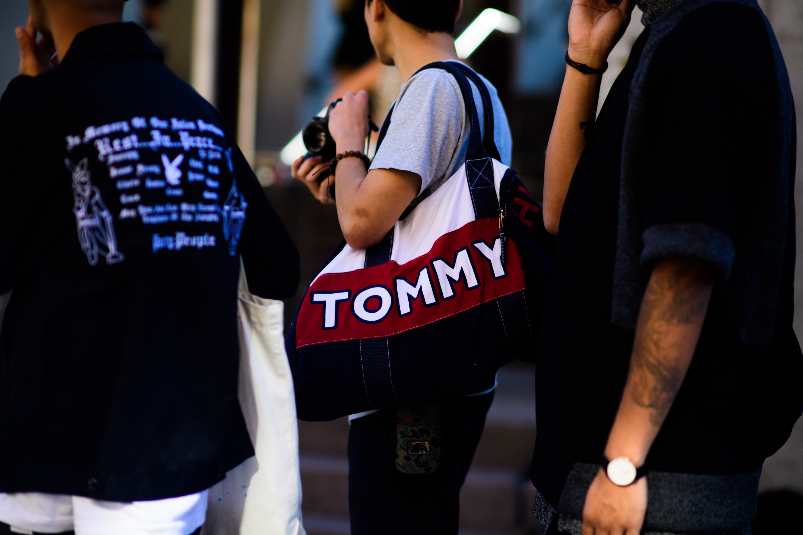 Man holding Tommy Hilfiger bag
