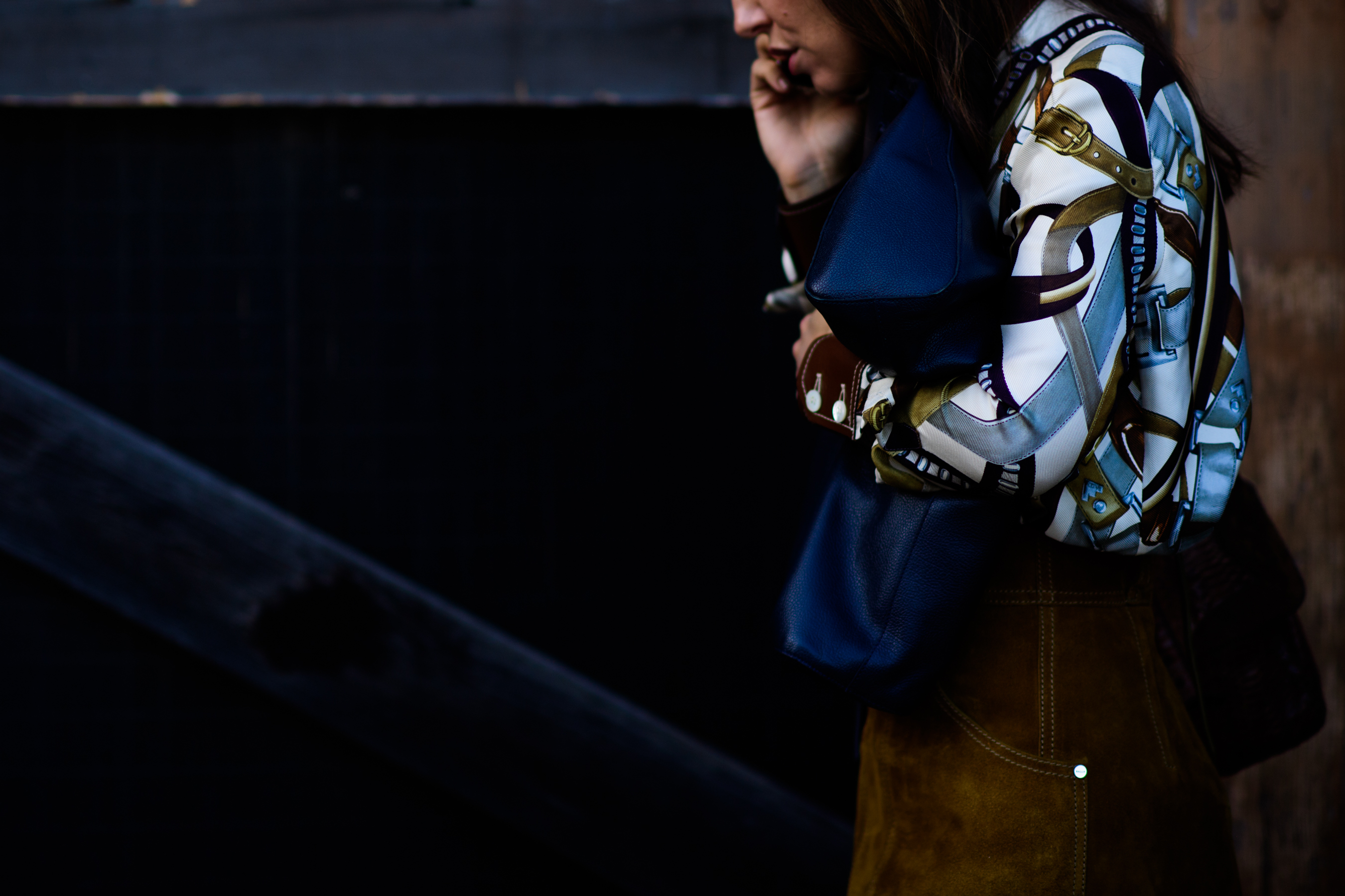 Woman wearing belt printed shirt