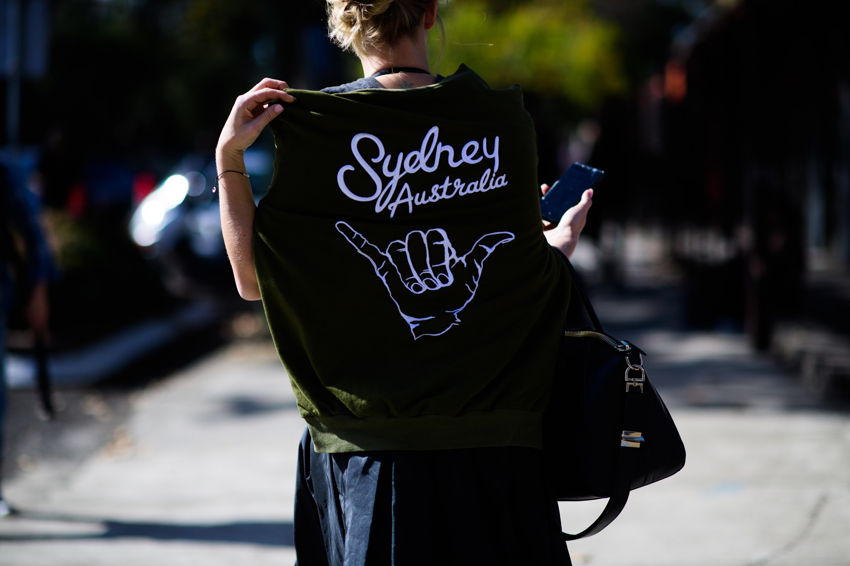 Woman wearing Sydney printed sweatshirt