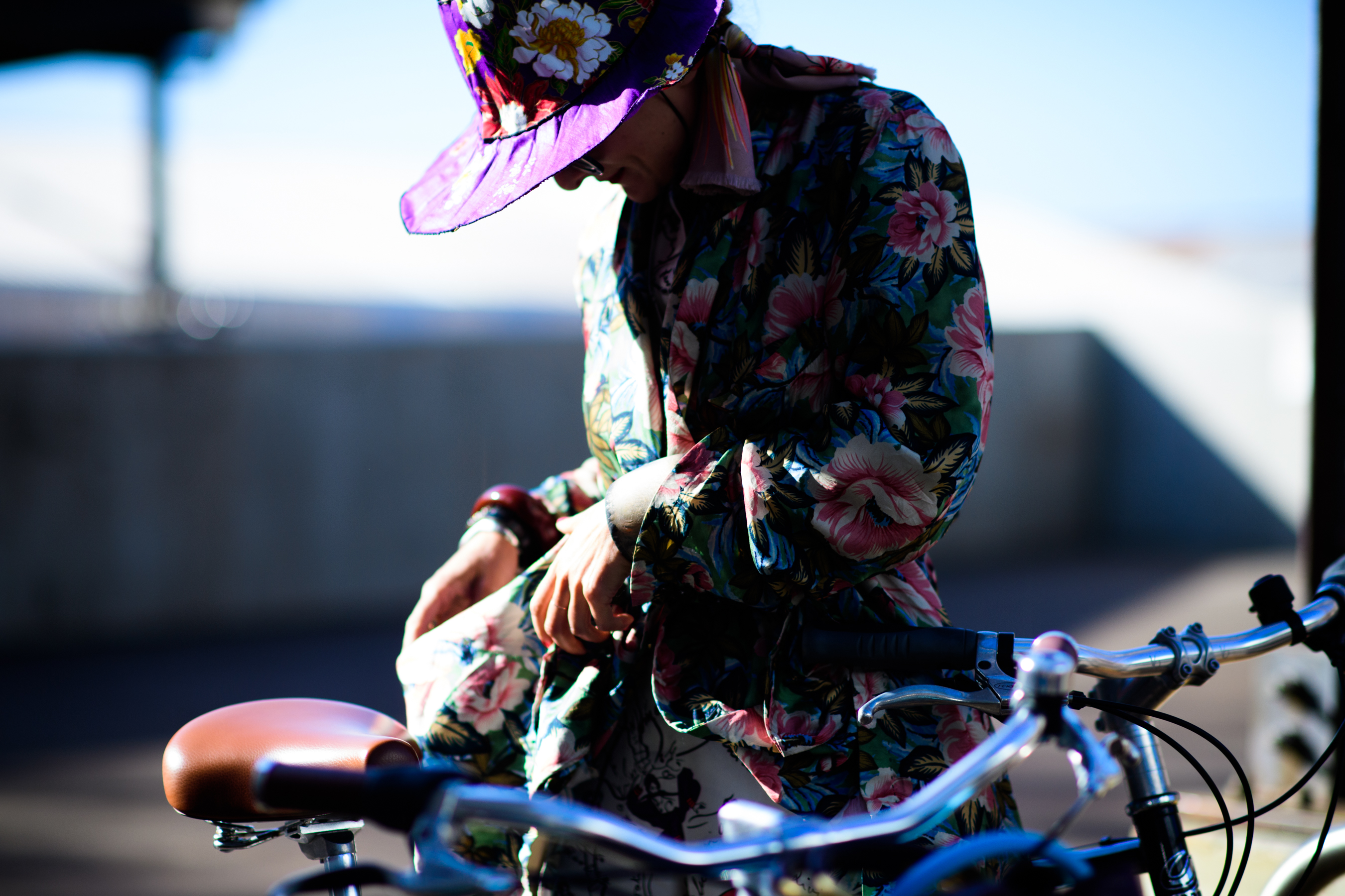 Stylist wearing floral outfit and bike