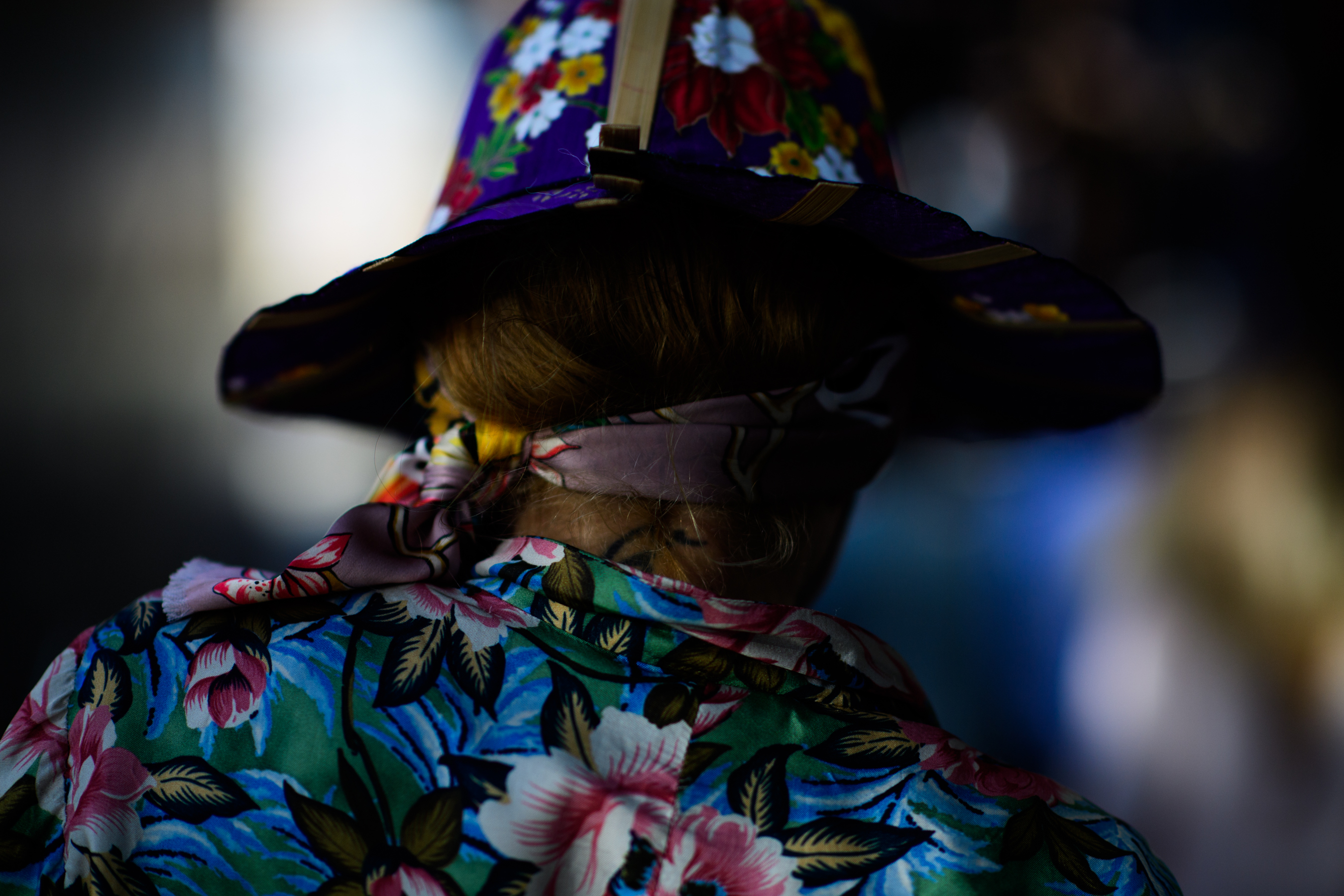 Stylist wearing floral hat and blazer