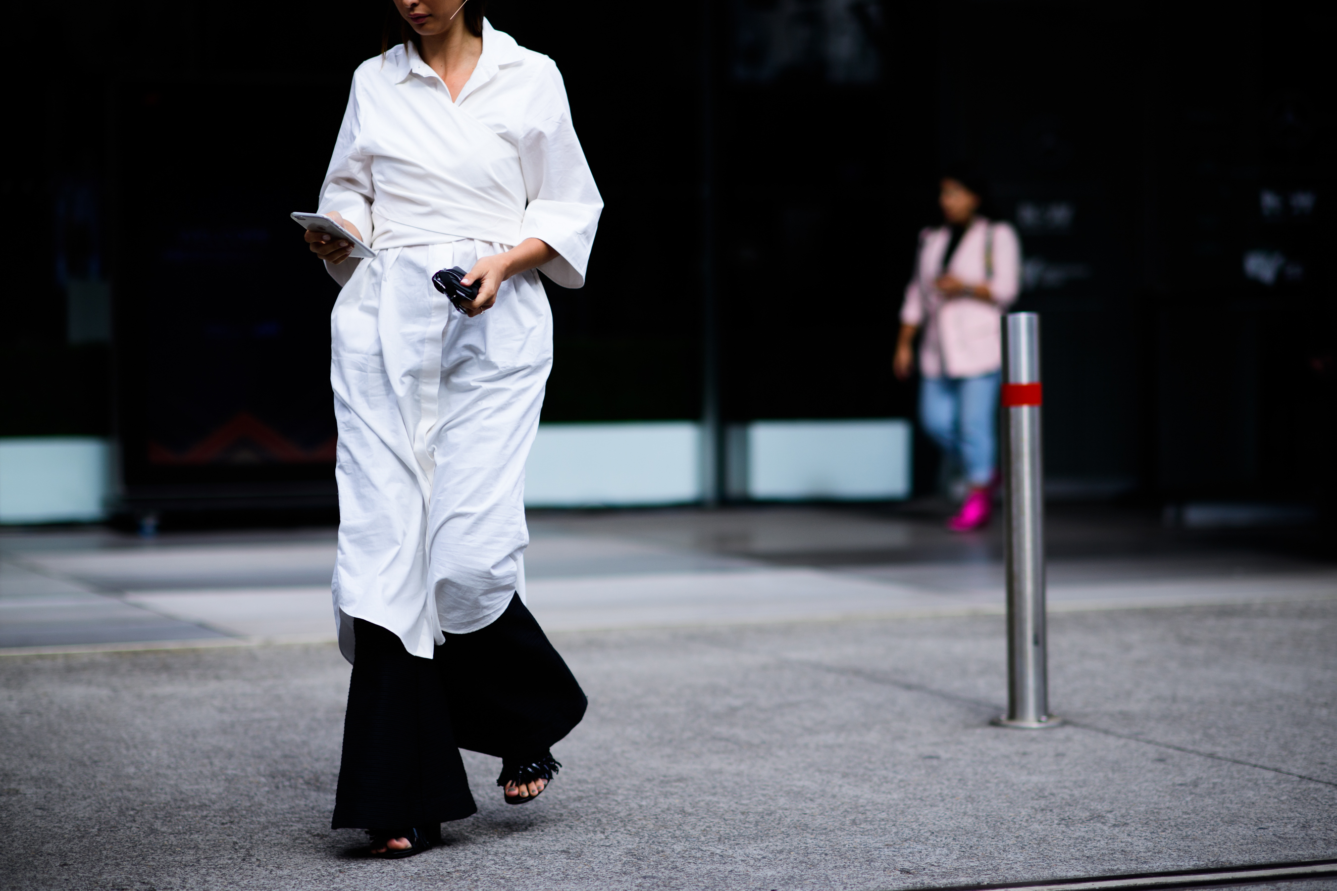 Woman wearing white shirt dress