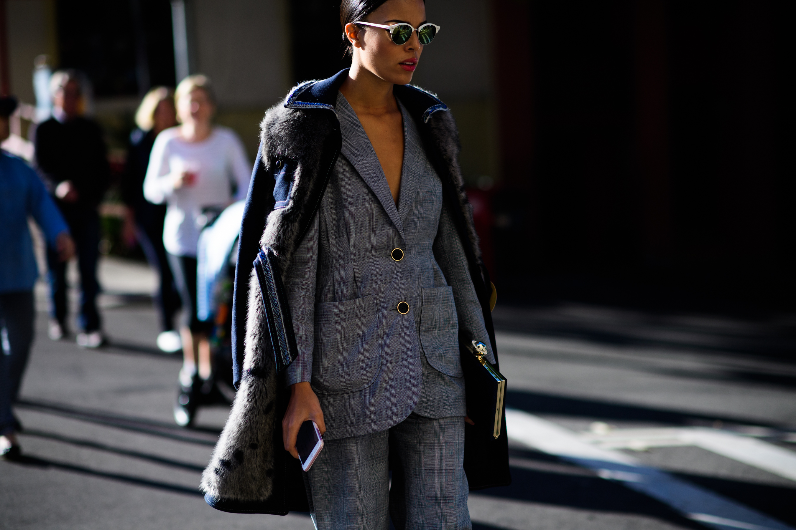Woman wearing grey suit and parka