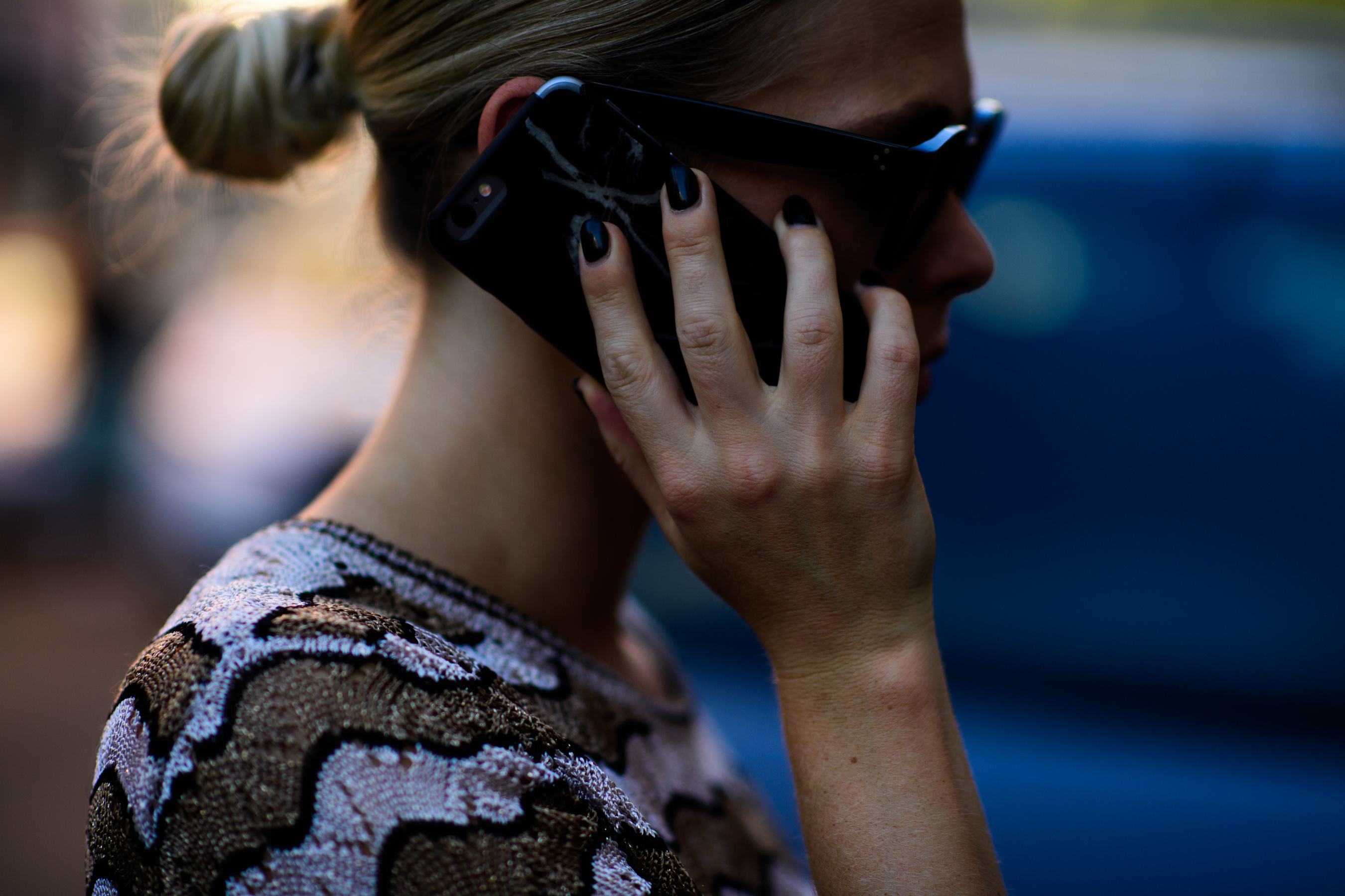 Woman talking on marble case phone