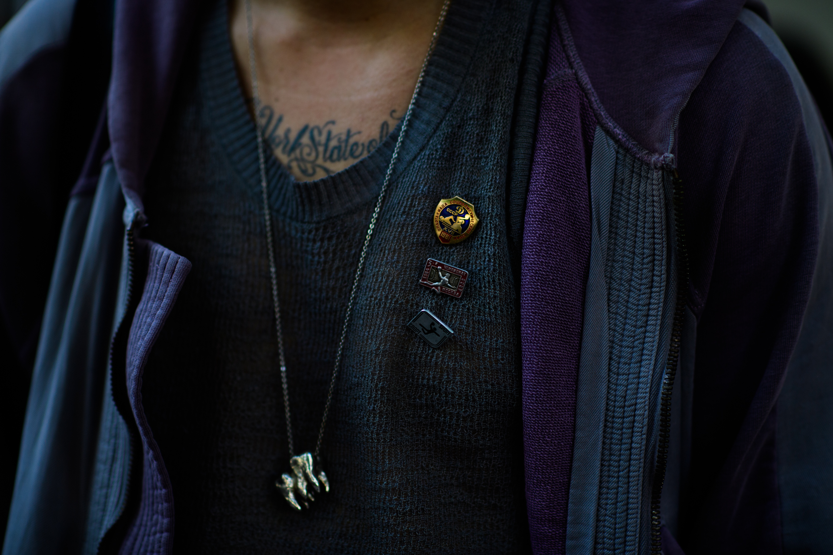 French photographer wearing vintage pins