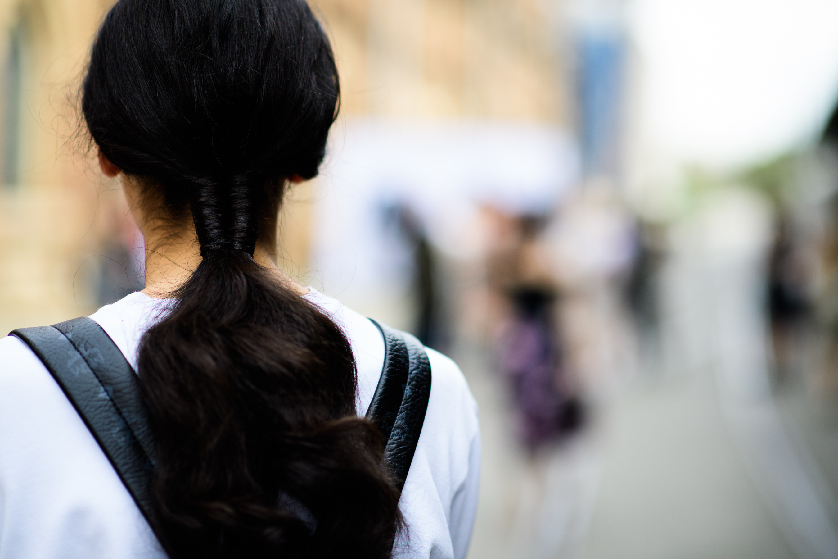Model with hair tied in complex knot