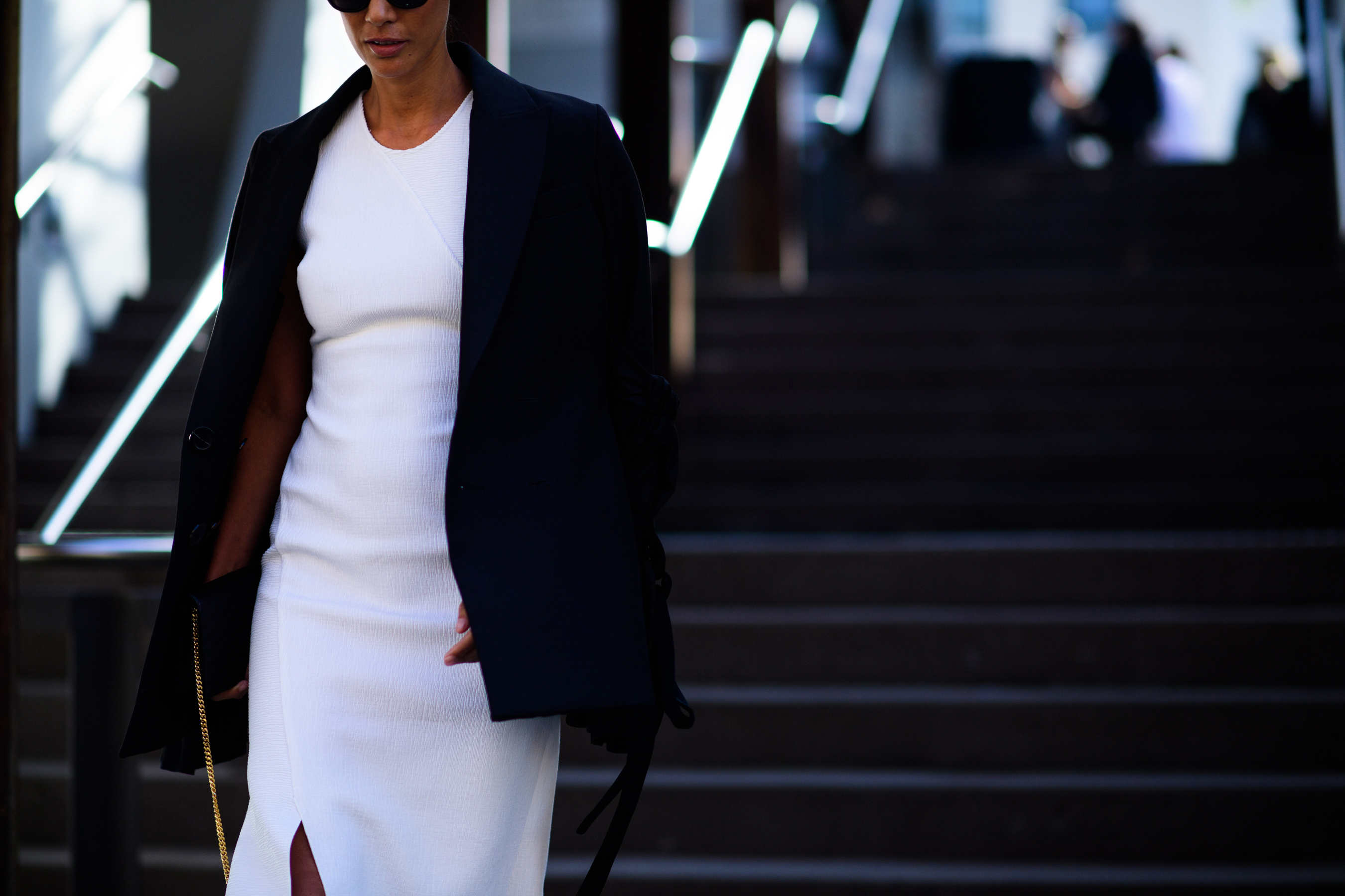 Woman wearing white dress and blazer