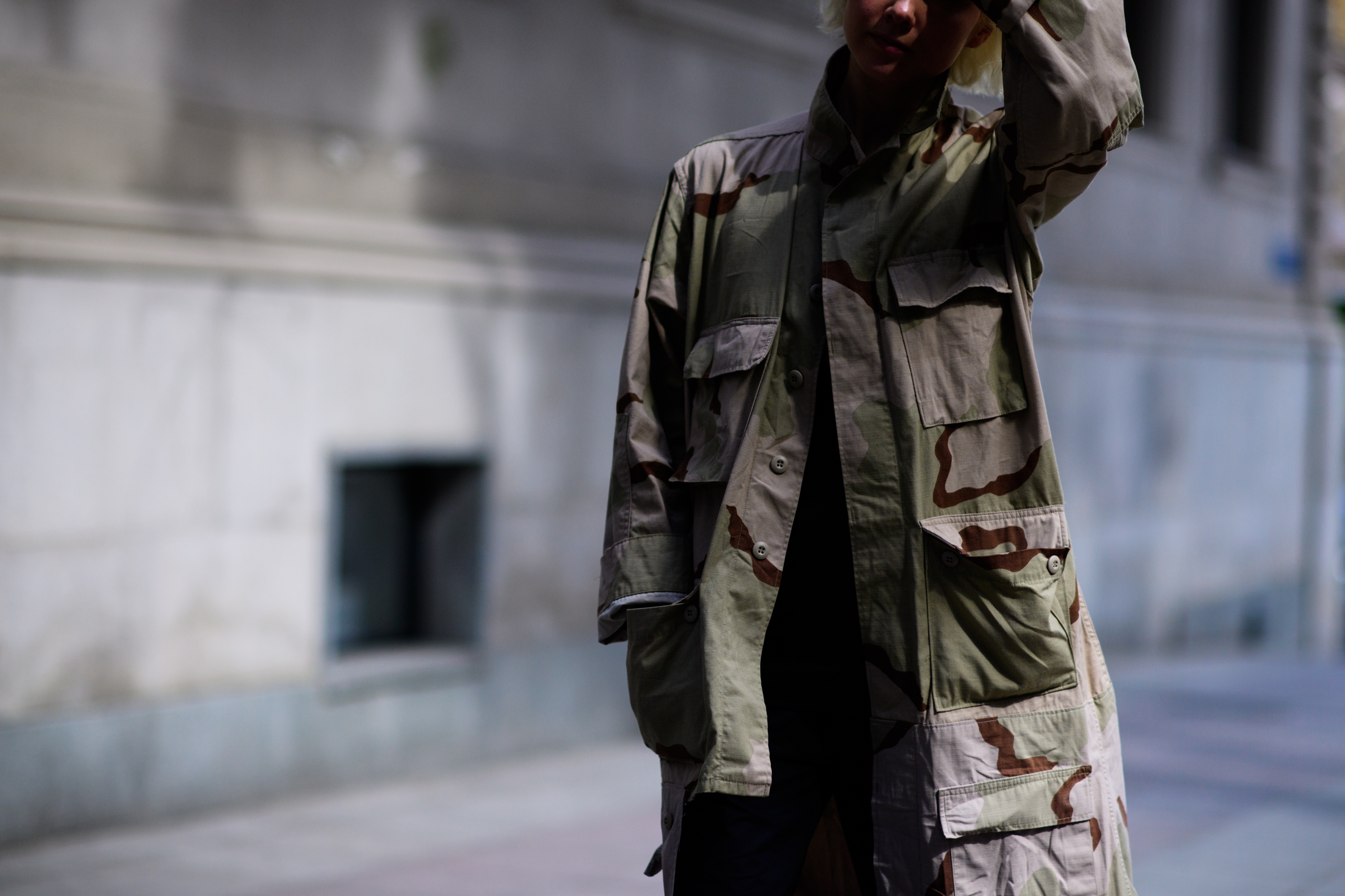 KM20 store owner wearing military coat