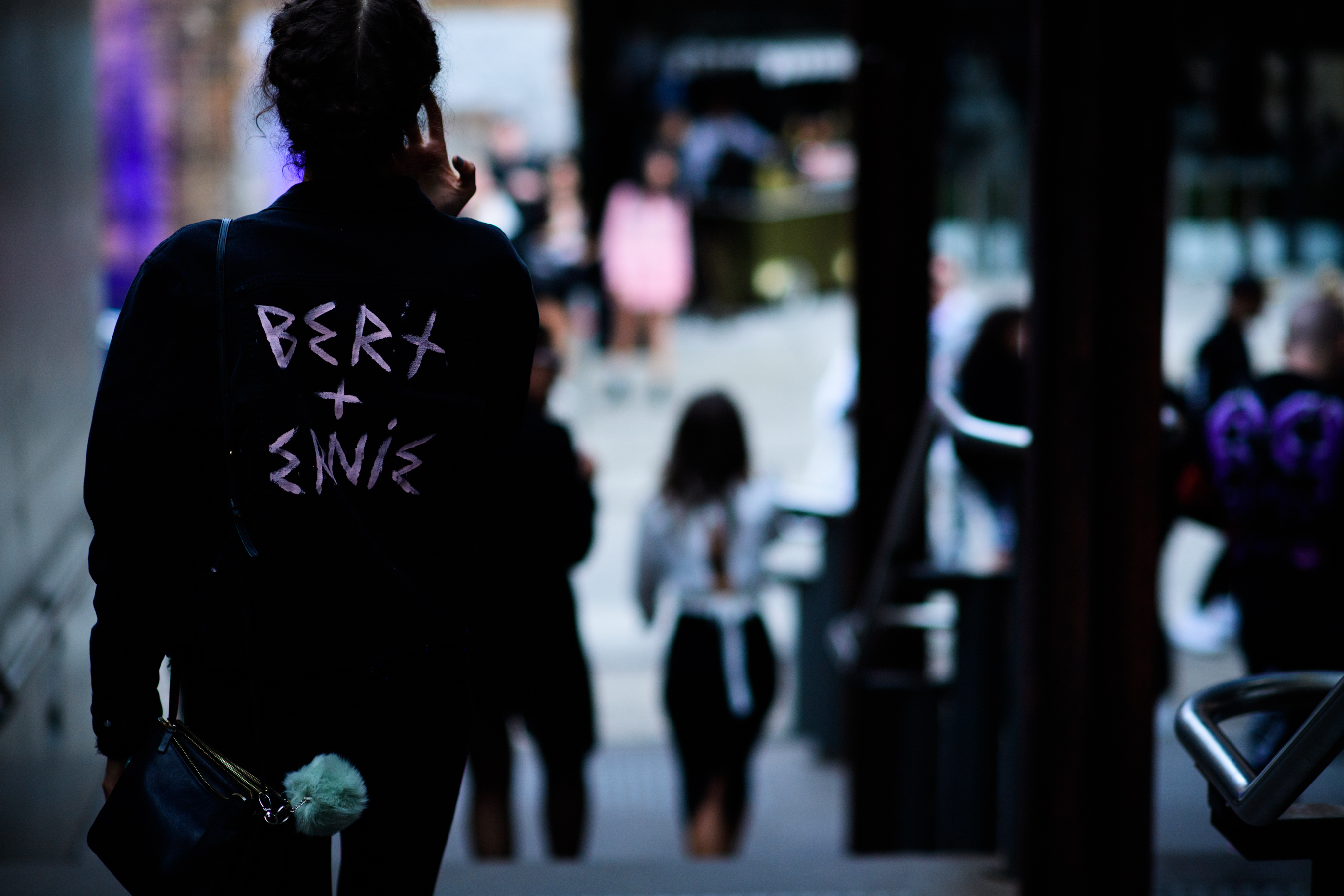 Woman wearing jacket with letters