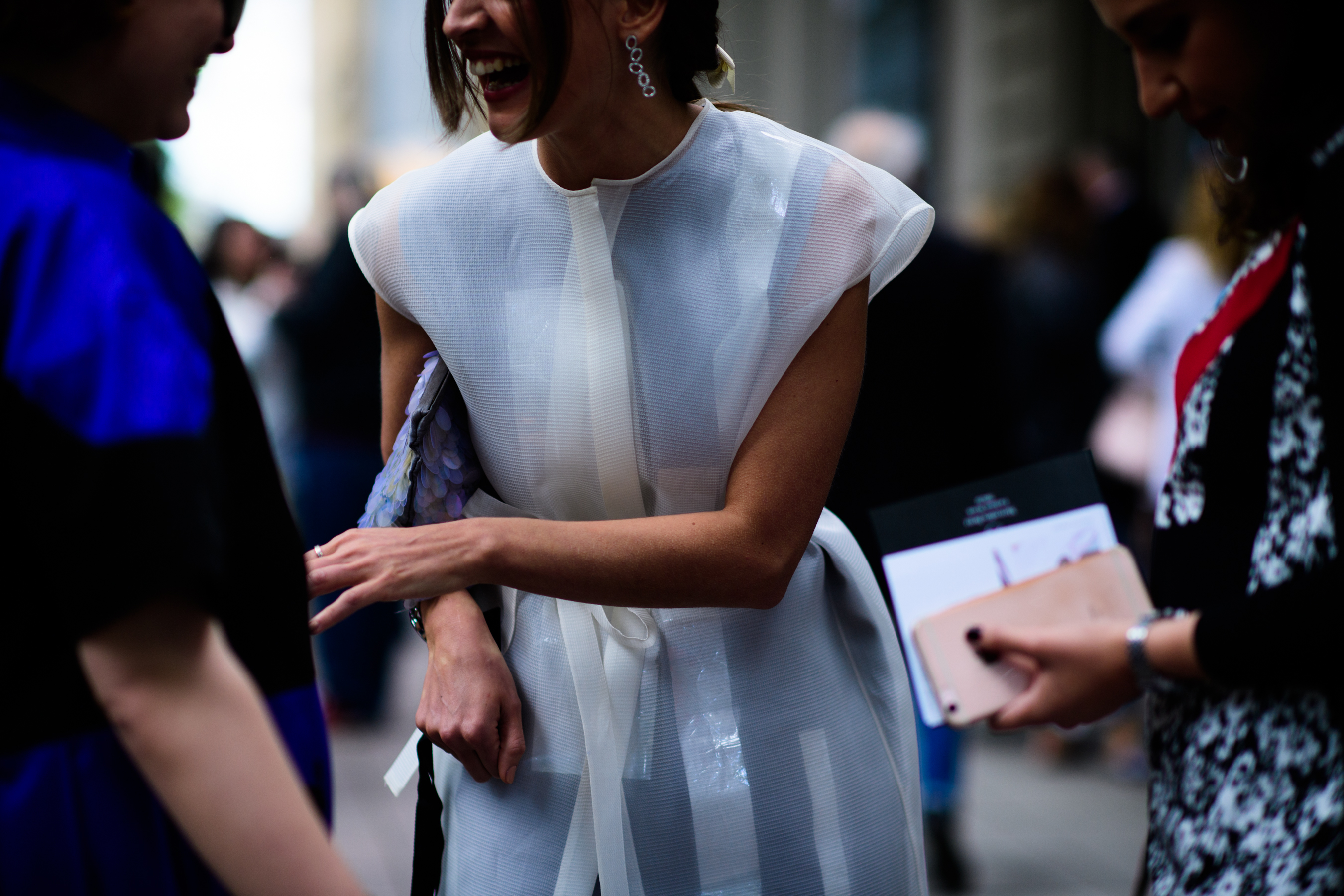 Woman wearing white transparent top