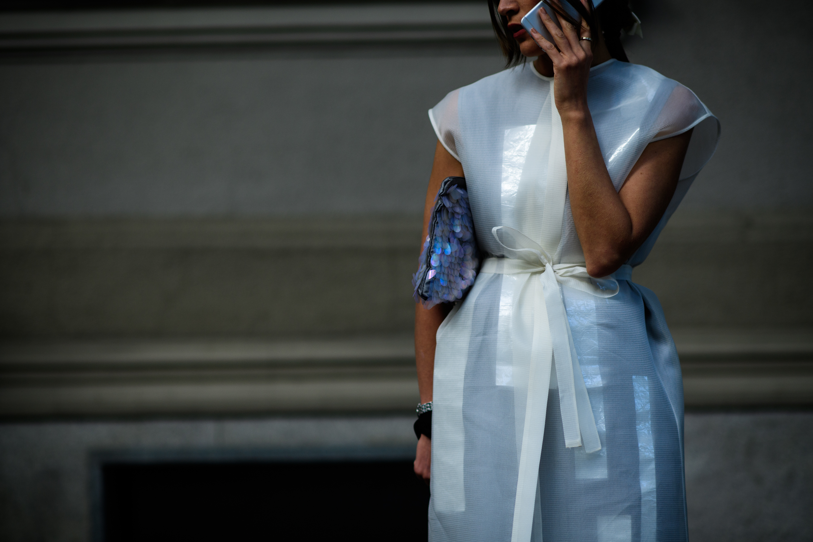 Woman wearing white transparent top
