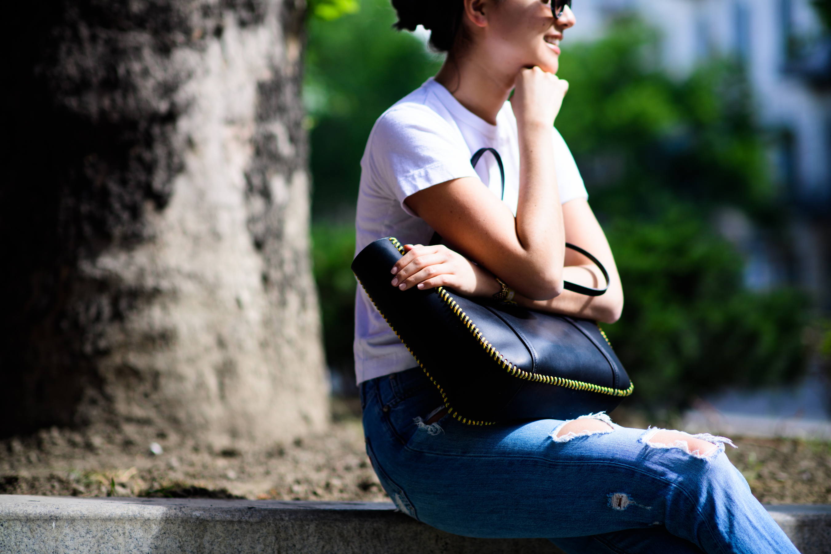 Woman with stitched black bag