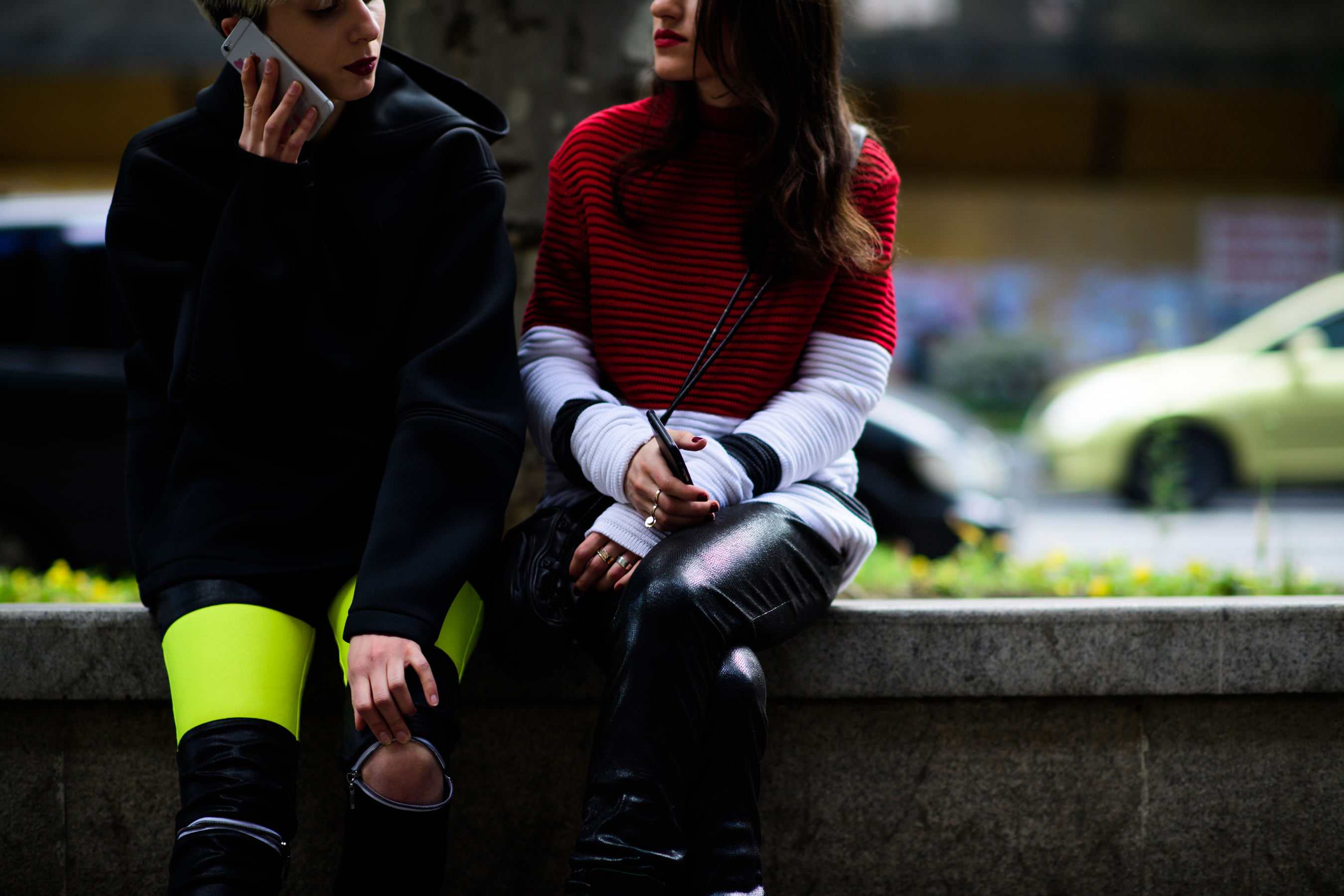 Two girls wearing leather pants