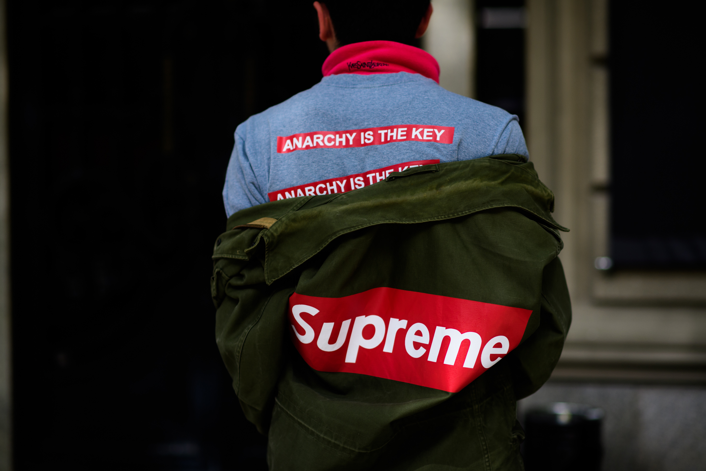 Man wearing logos on his back